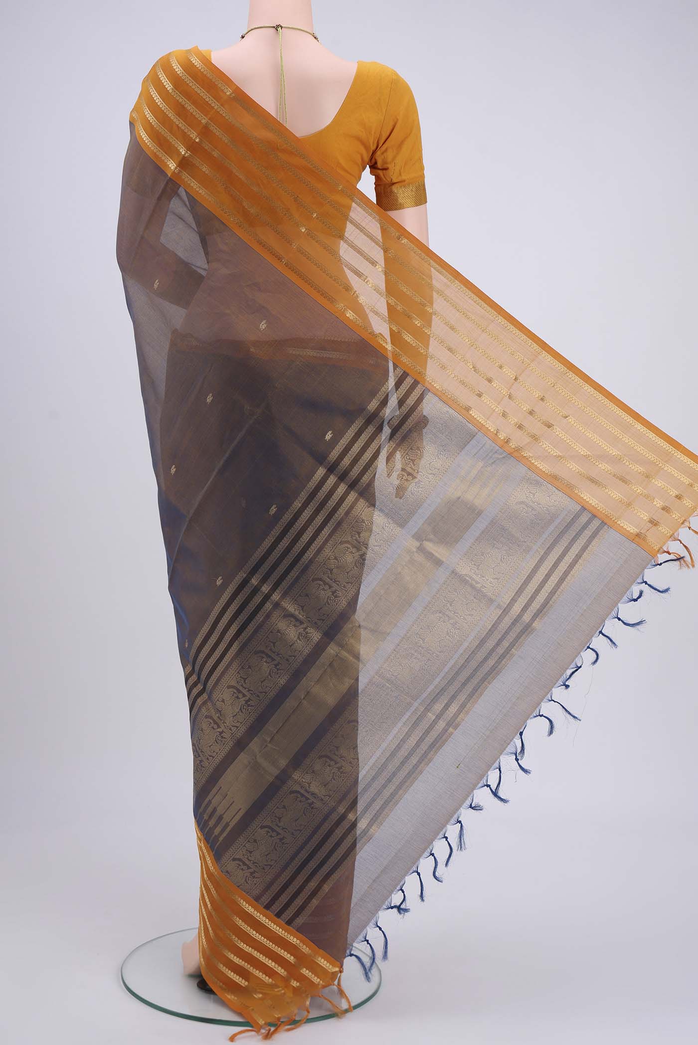 Flat view of Brown Dual Tone Blended Coimbatore Silk Cotton Saree with Zari Butta on the body and Zari Border. 