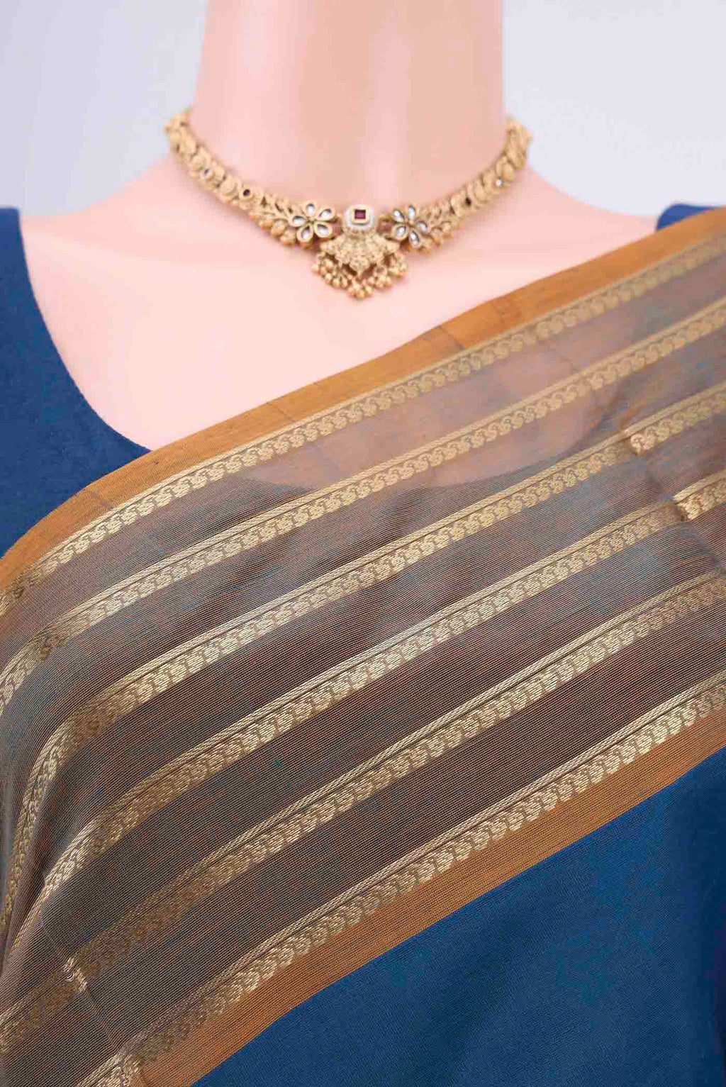 Border image of Blue Silk Cotton Saree with Zari Butta on the body and Zari Border. 