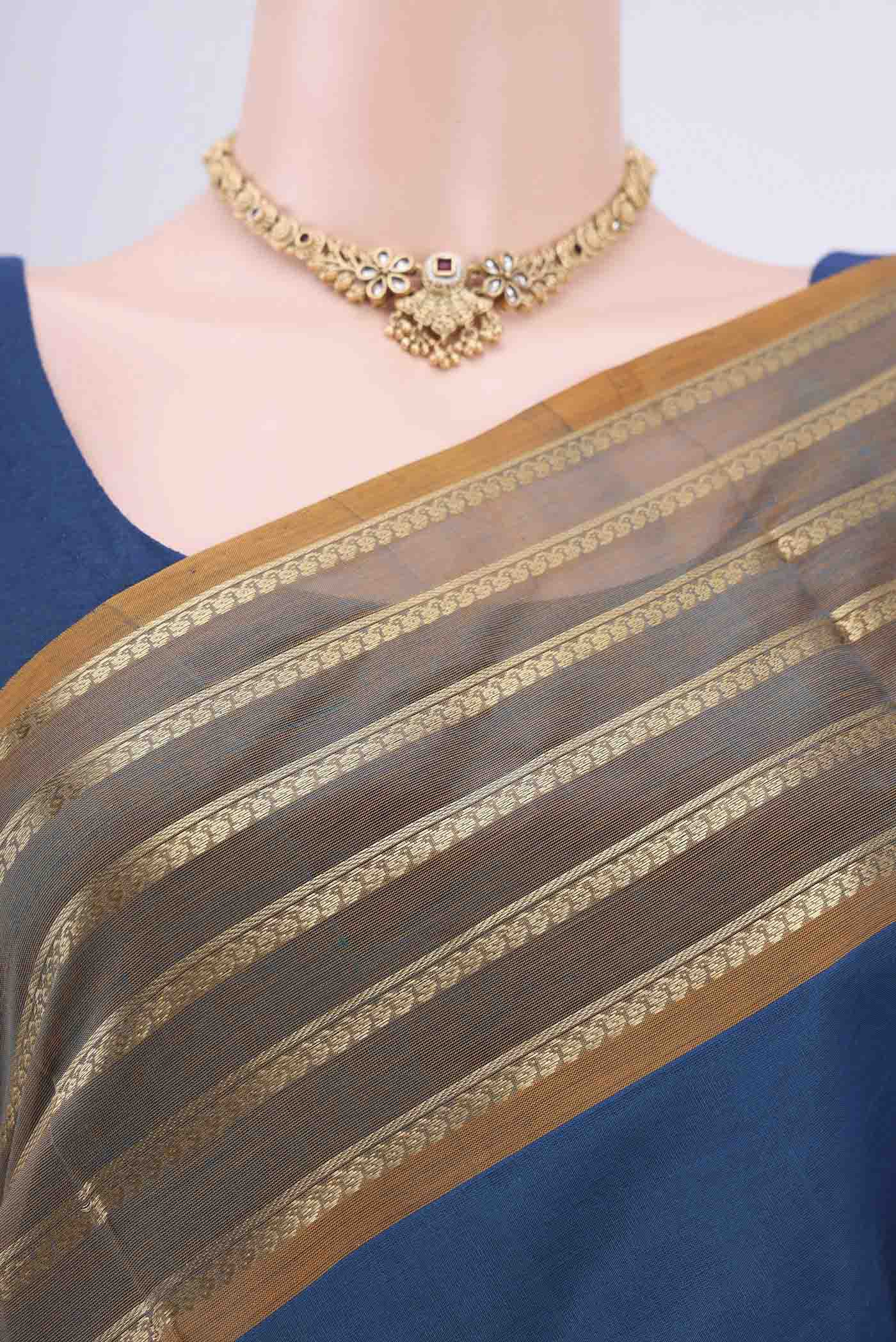 Border image of Blue Silk Cotton Saree with Zari Butta on the body and Zari Border. 