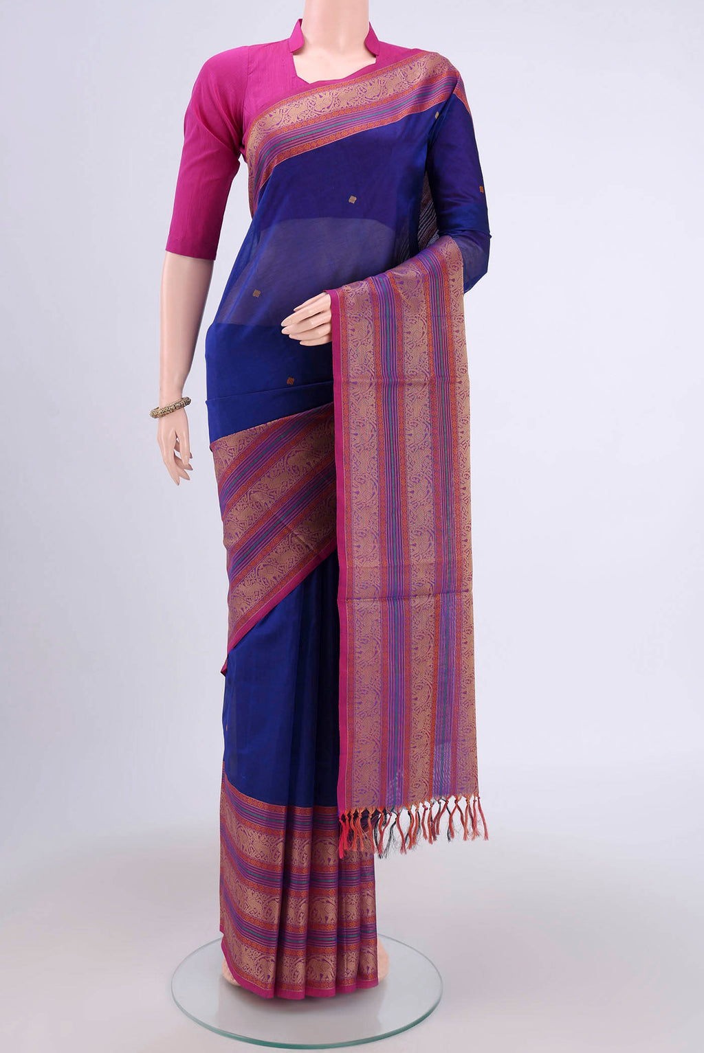 Royal Blue Silk Cotton Saree with Thread Butta on the body and Zari Border.  displayed on a mannequin
