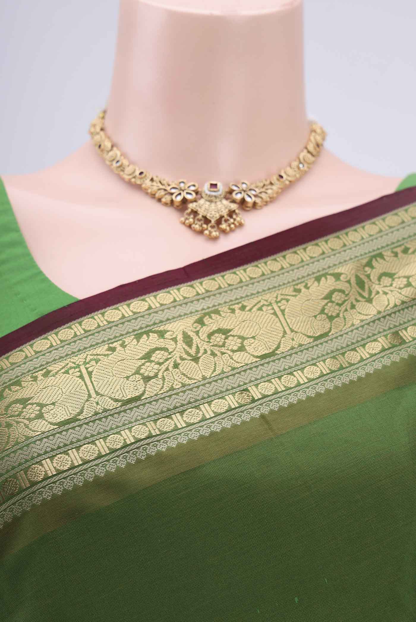 Border image of Light Green Blended Coimbatore Silk Cotton Saree with Zari Butta on the body and Zari Border. 