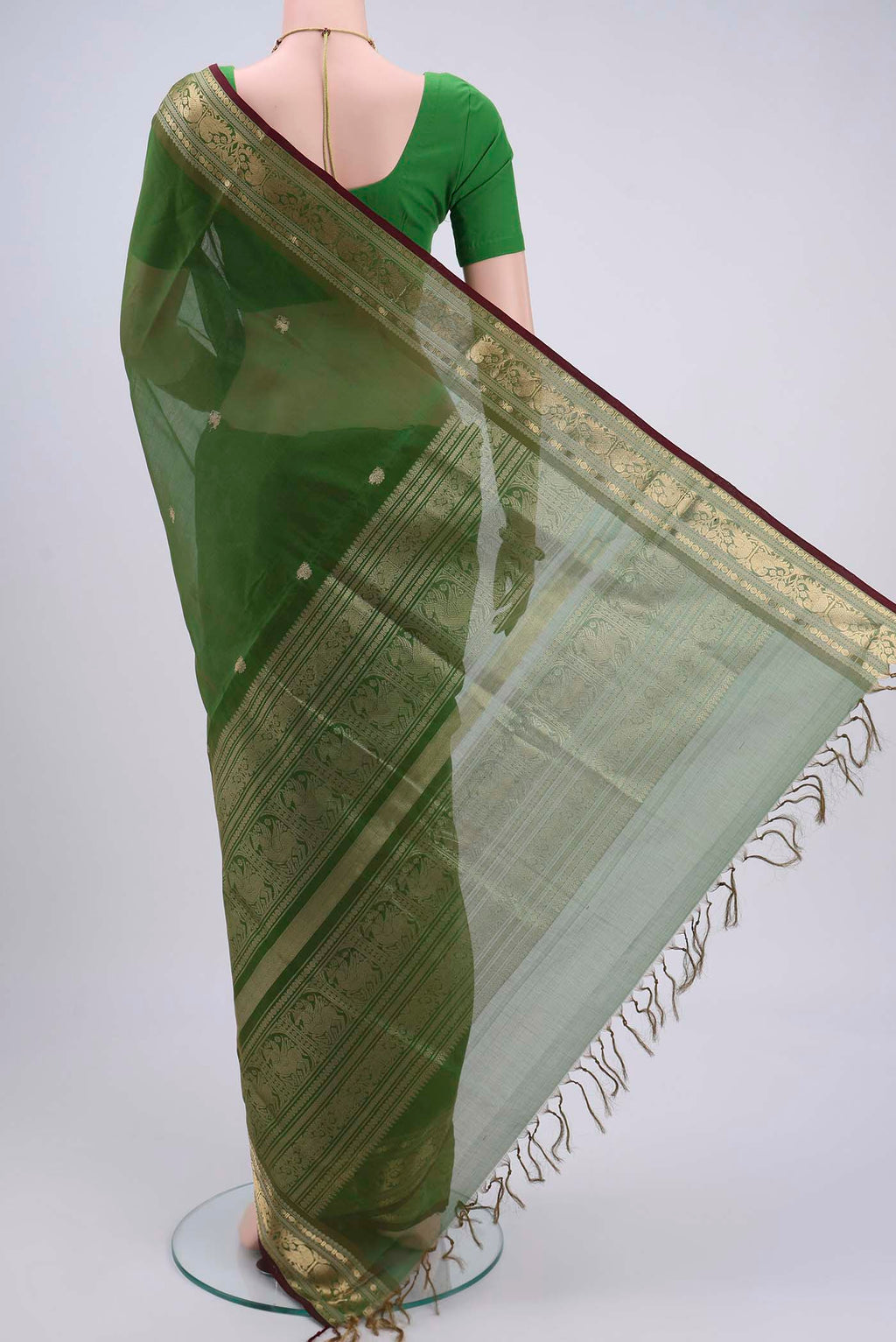Flat view of Light Green Blended Coimbatore Silk Cotton Saree with Zari Butta on the body and Zari Border. 