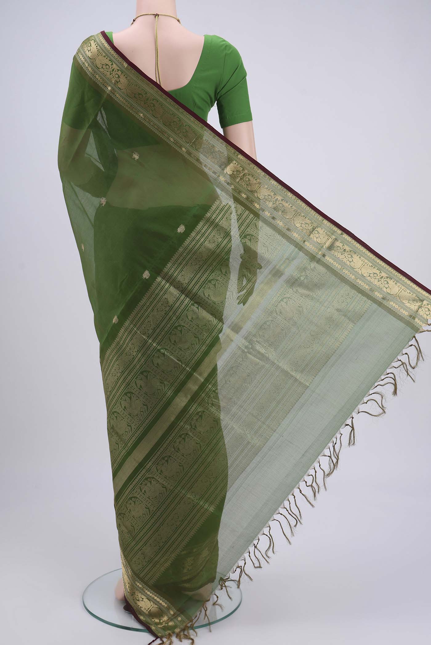 Flat view of Light Green Blended Coimbatore Silk Cotton Saree with Zari Butta on the body and Zari Border. 