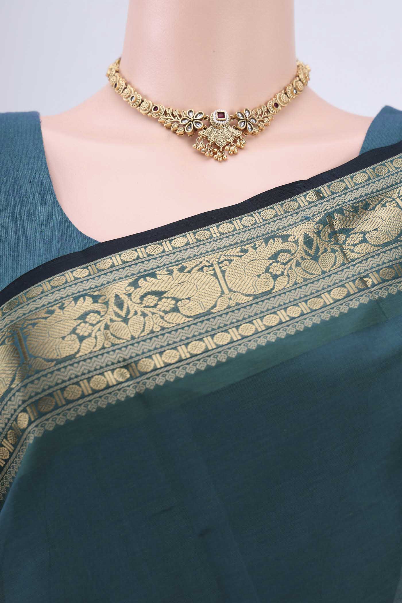 Border image of Green Silk Cotton Saree with Zari Butta on the body and Zari Border. 