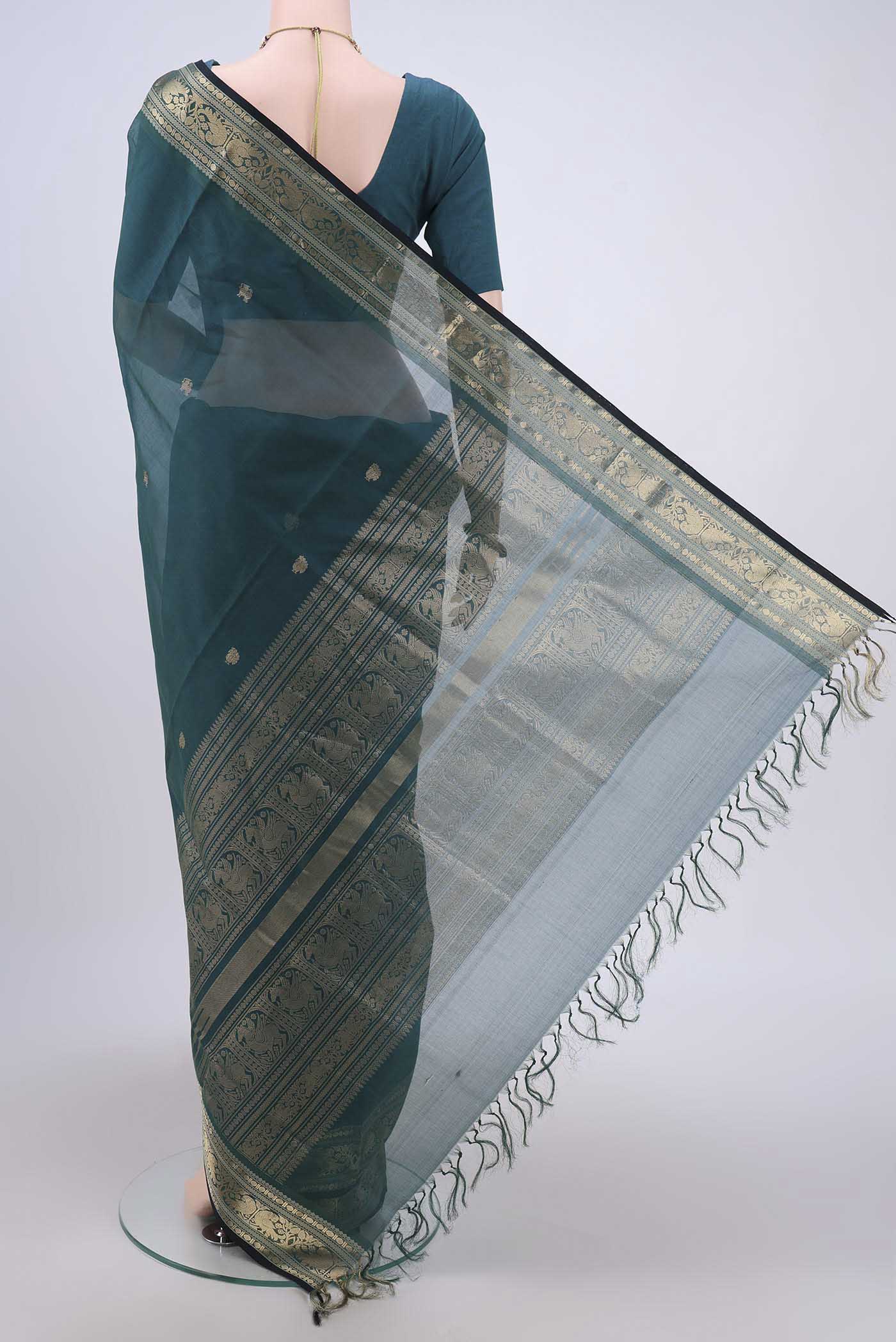 Flat view of Green Silk Cotton Saree with Zari Butta on the body and Zari Border. 