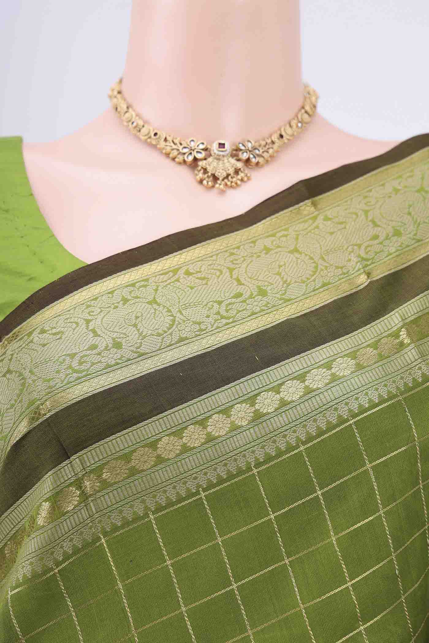 Border image of Light Green Silk Cotton Saree with Checked design on the body and Zari And Thread Border. 