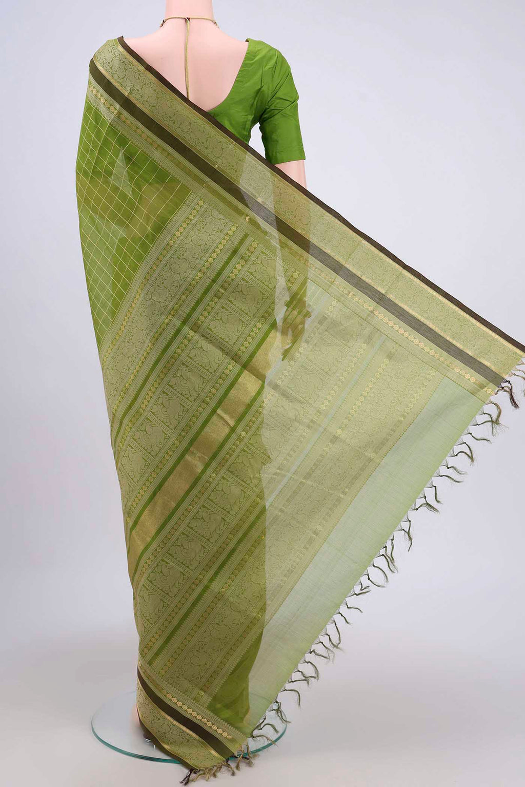 Flat view of Light Green Silk Cotton Saree with Checked design on the body and Zari And Thread Border. 