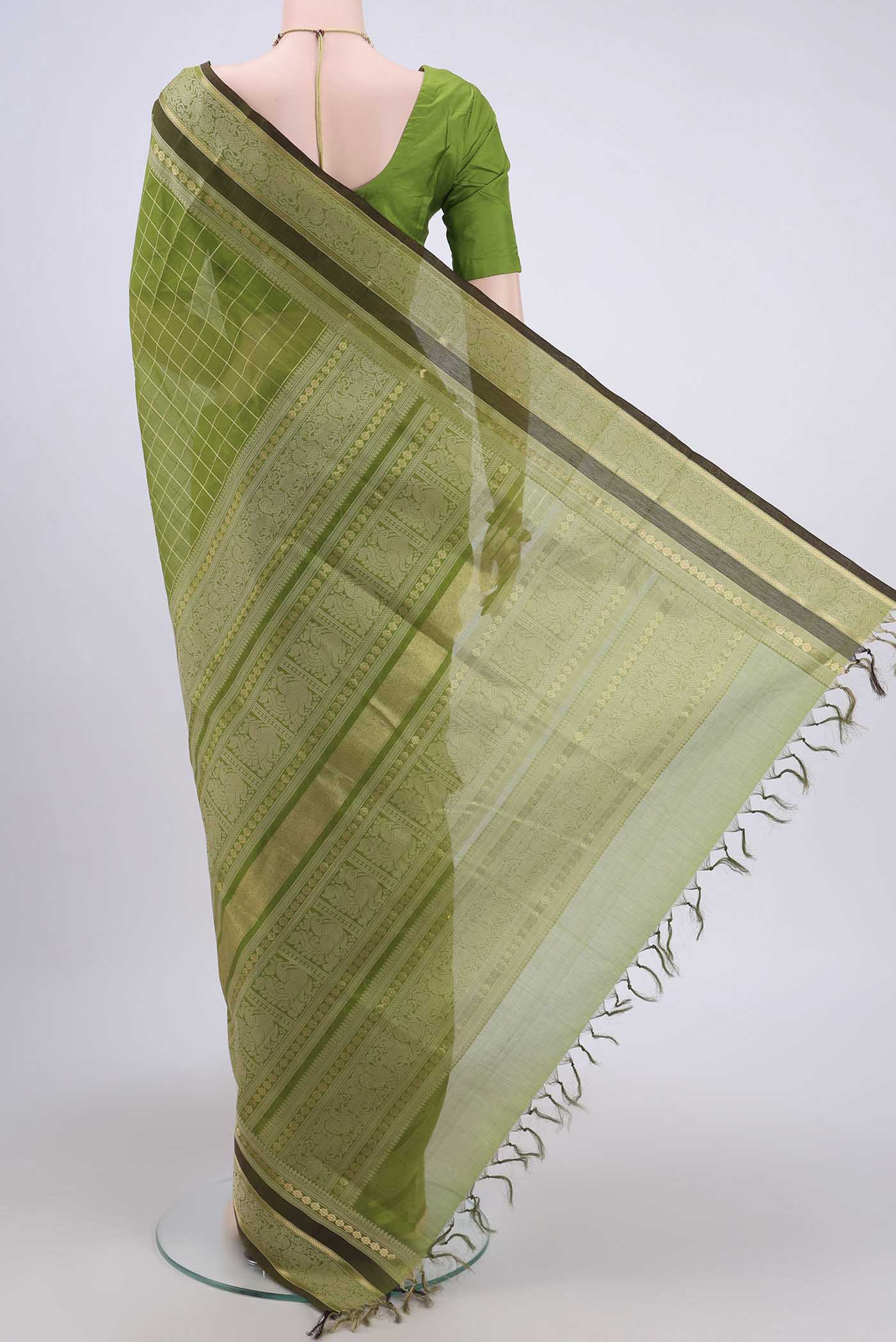 Flat view of Light Green Silk Cotton Saree with Checked design on the body and Zari And Thread Border. 