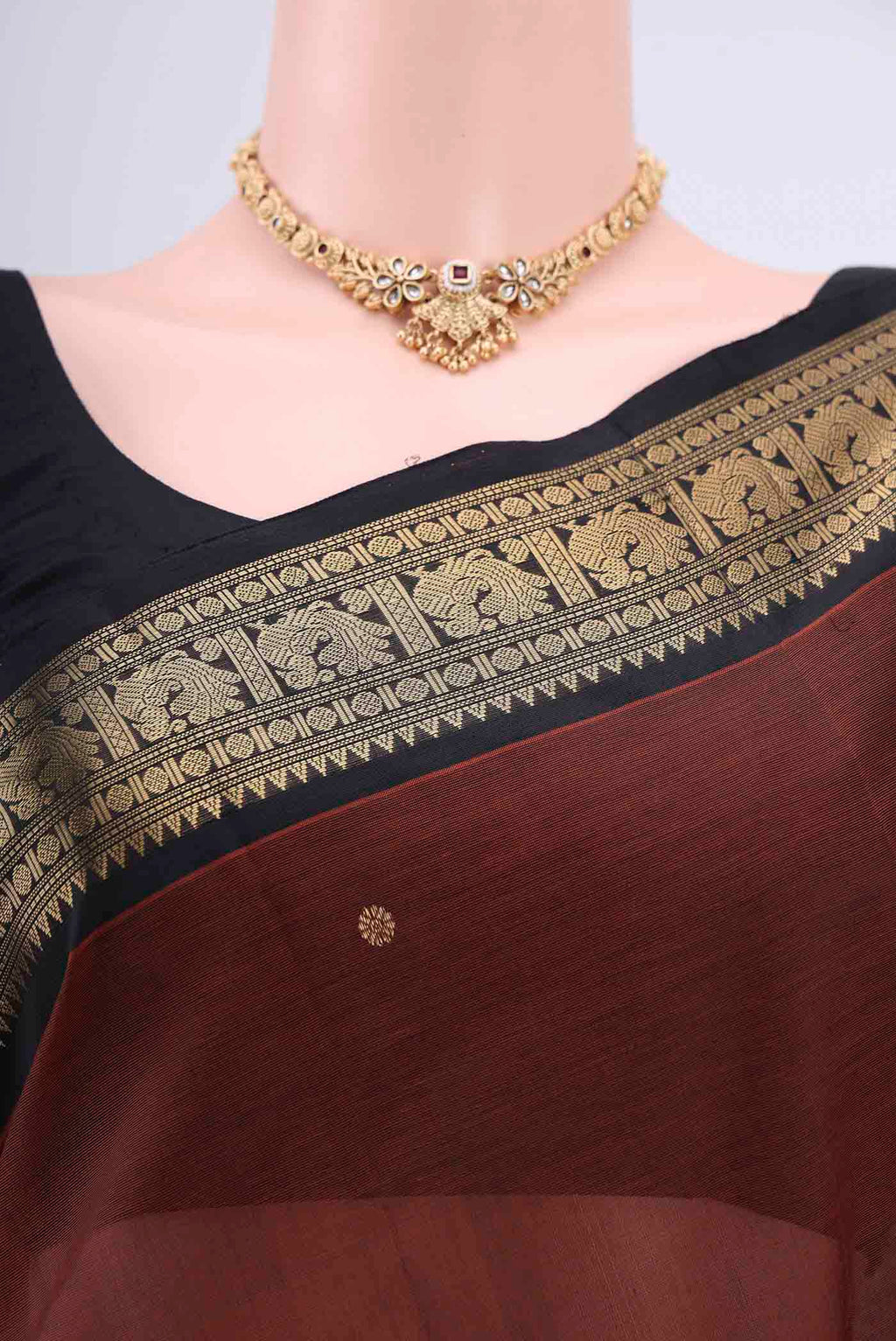 Border image of Brown Silk Cotton Saree with Zari Butta on the body and Zari Border. 