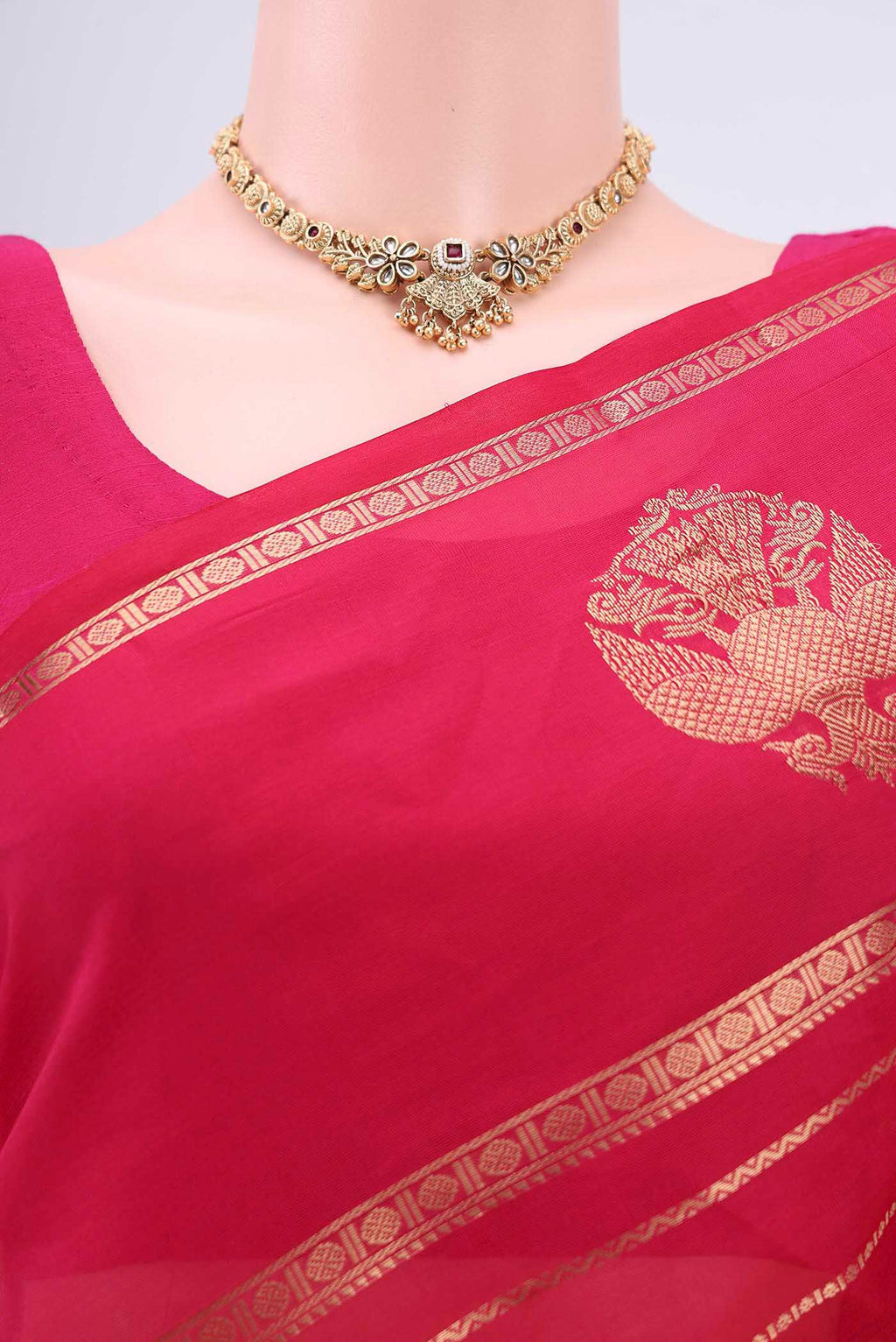Border image of Rani Pink Silk Cotton Saree with Veldhari on the body and Zari Border. 