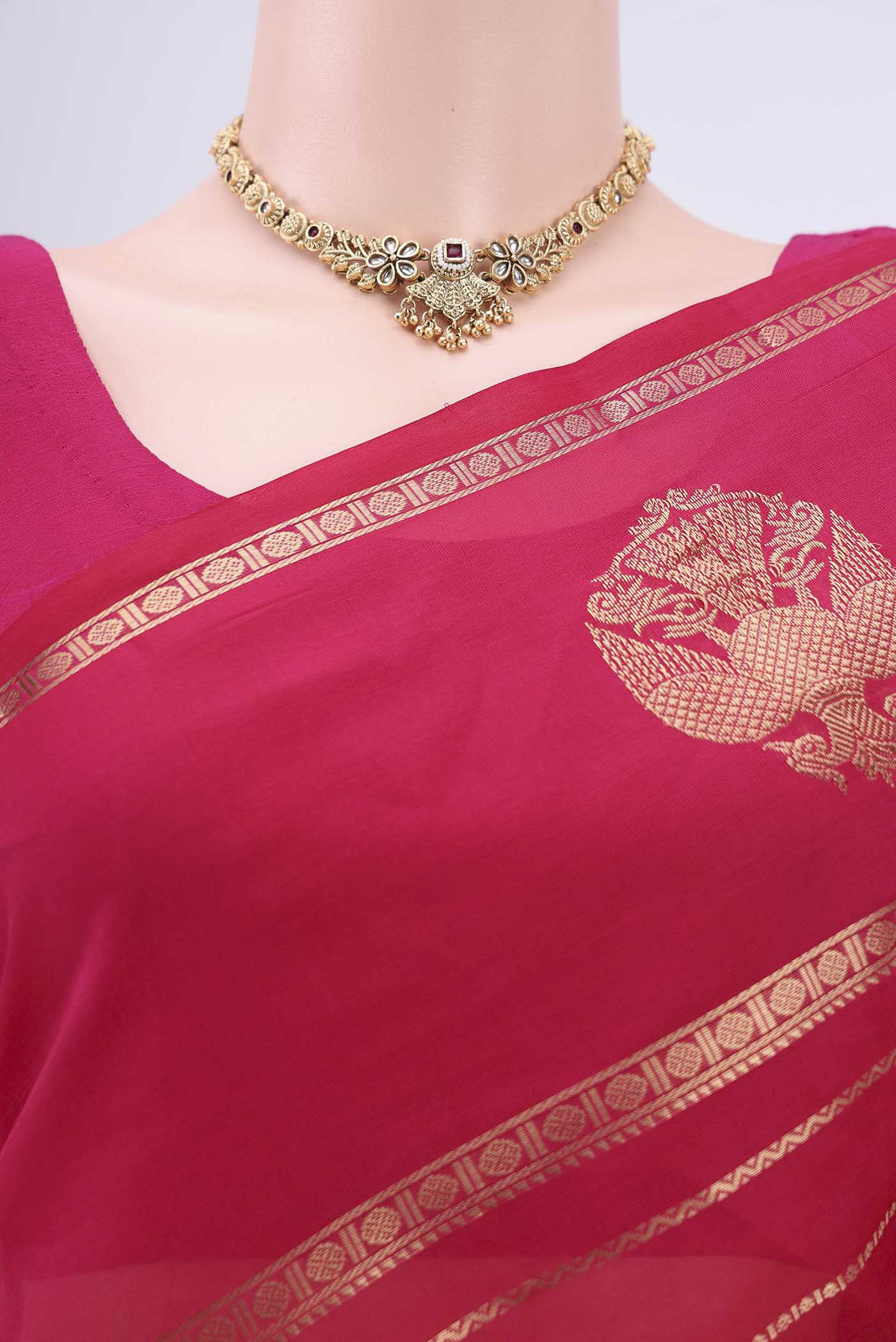Border image of Rani Pink Silk Cotton Saree with Veldhari on the body and Zari Border. 