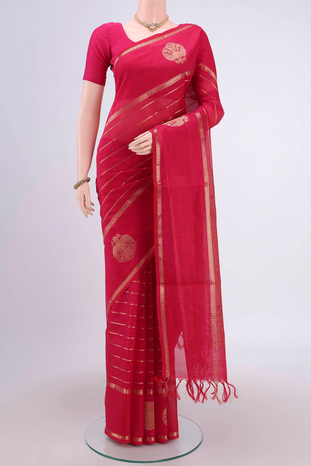Rani Pink Silk Cotton Saree with Veldhari on the body and Zari Border.  displayed on a mannequin