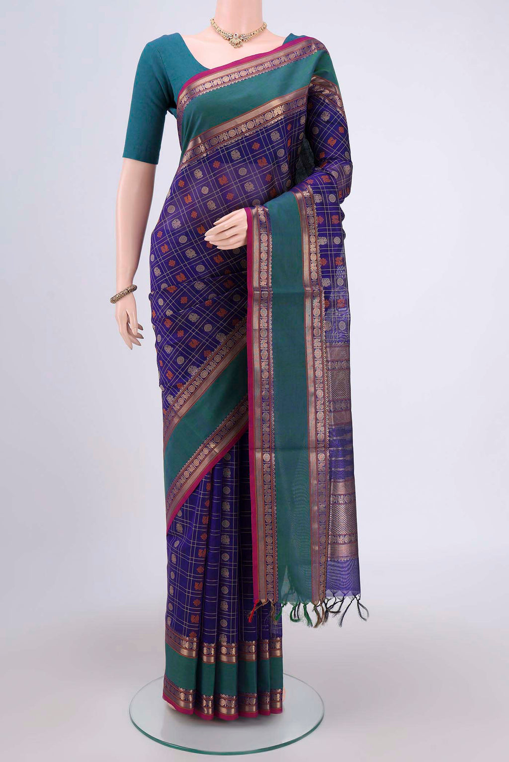 Purple Silk Cotton Saree with Checked design on the body and Zari Border.  displayed on a mannequin