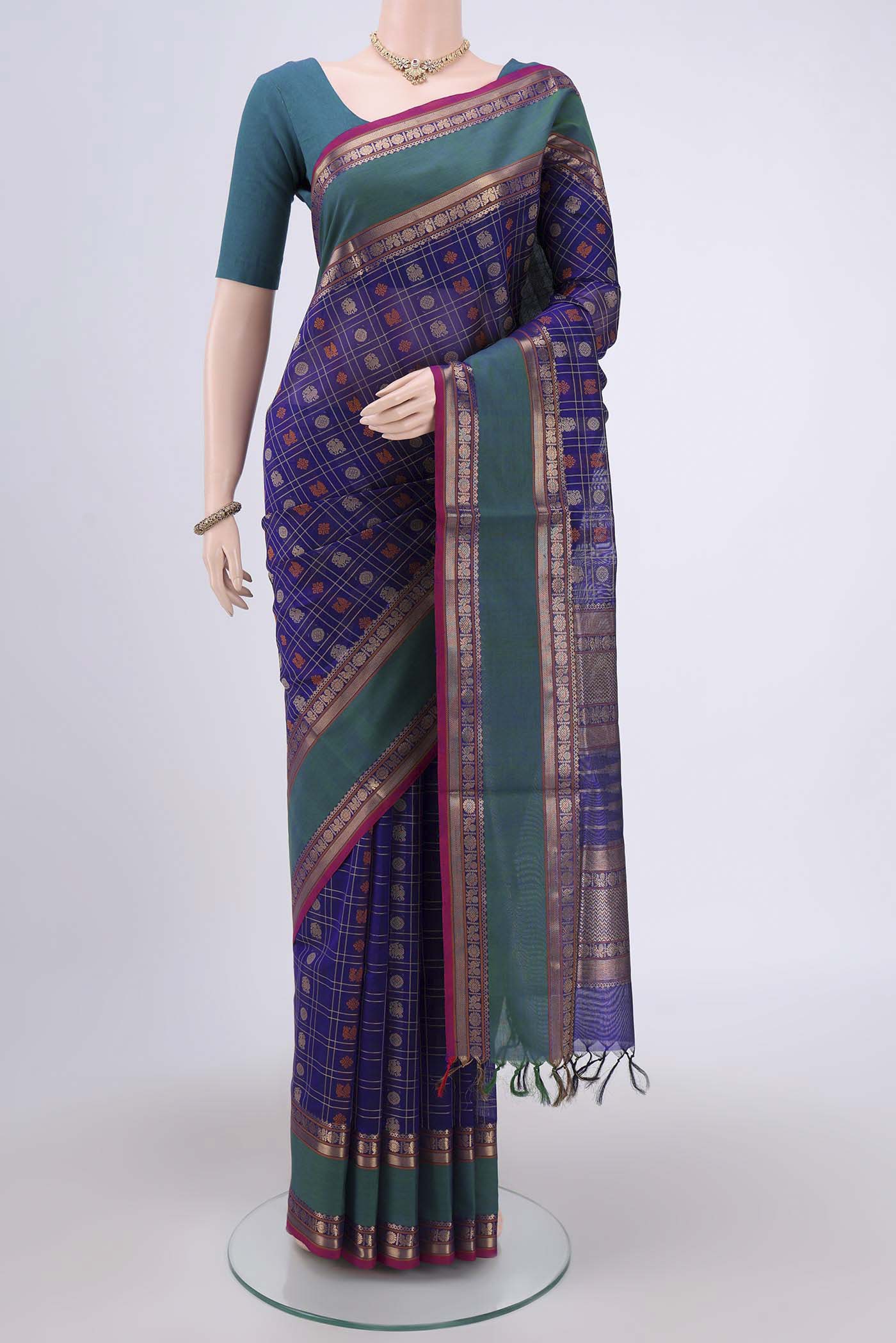 Purple Silk Cotton Saree with Checked design on the body and Zari Border.  displayed on a mannequin