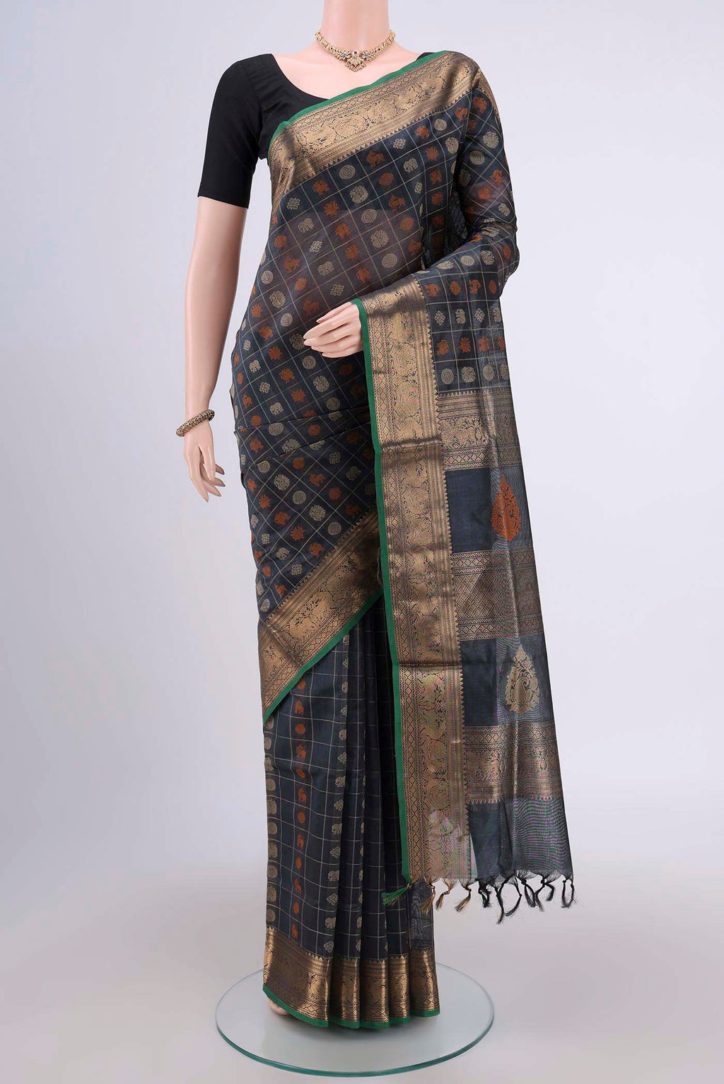 Davys Grey Silk Cotton Saree with Checked design on the body and Zari Border.  displayed on a mannequin