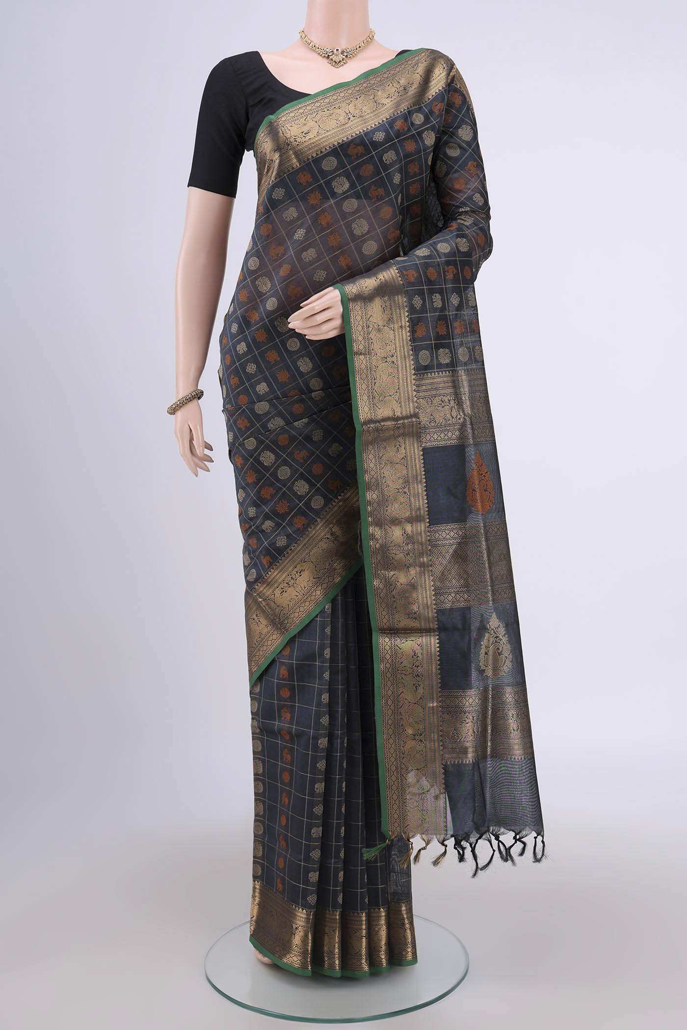 Davys Grey Silk Cotton Saree with Checked design on the body and Zari Border.  displayed on a mannequin