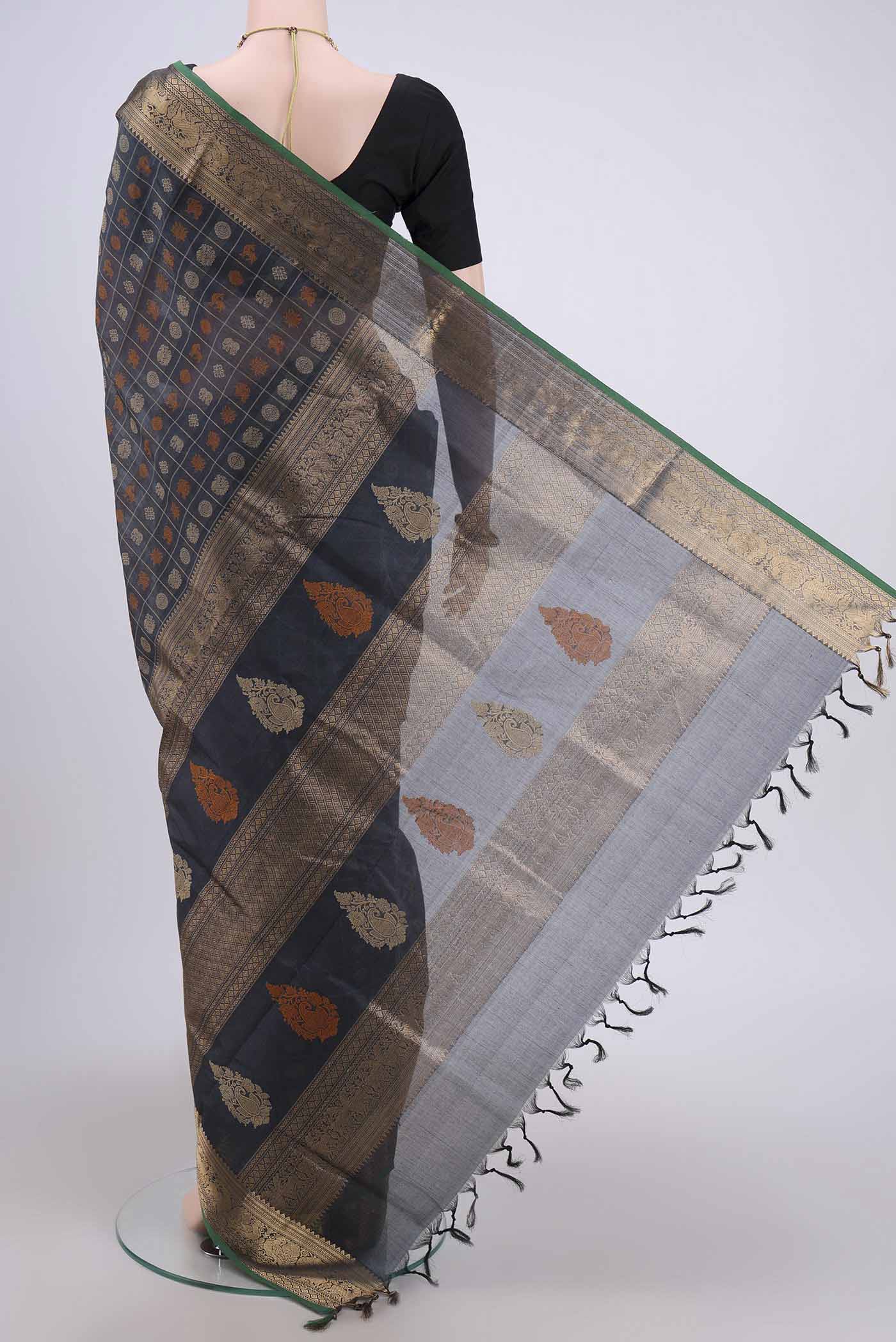 Flat view of Davys Grey Silk Cotton Saree with Checked design on the body and Zari Border. 