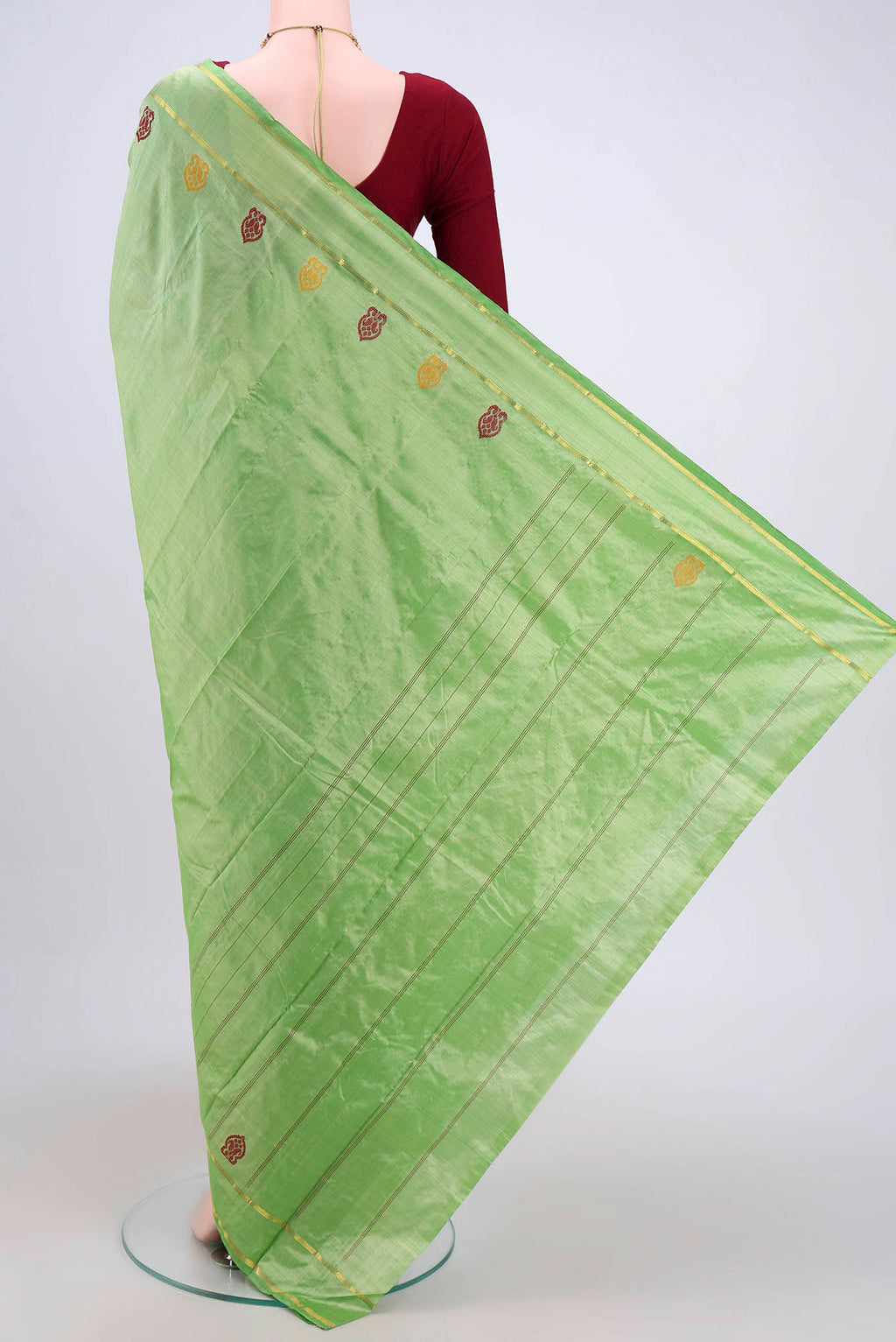 Flat view of Light Green Kanchipuram Saree with Plain Body and Zari And Thread Border. 