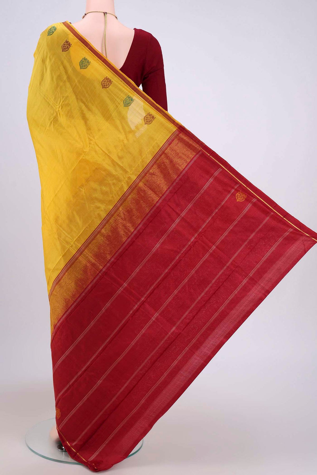 Flat view of Yellow Kanchipuram Silk Saree with Plain Body and Zari And Thread Border. 