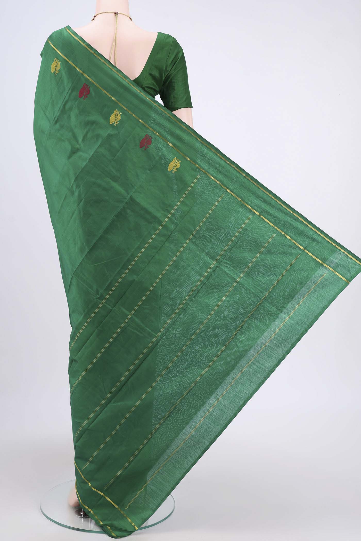 Flat view of Green Kanchipuram Silk Saree with Plain Body and Zari And Thread Border. 