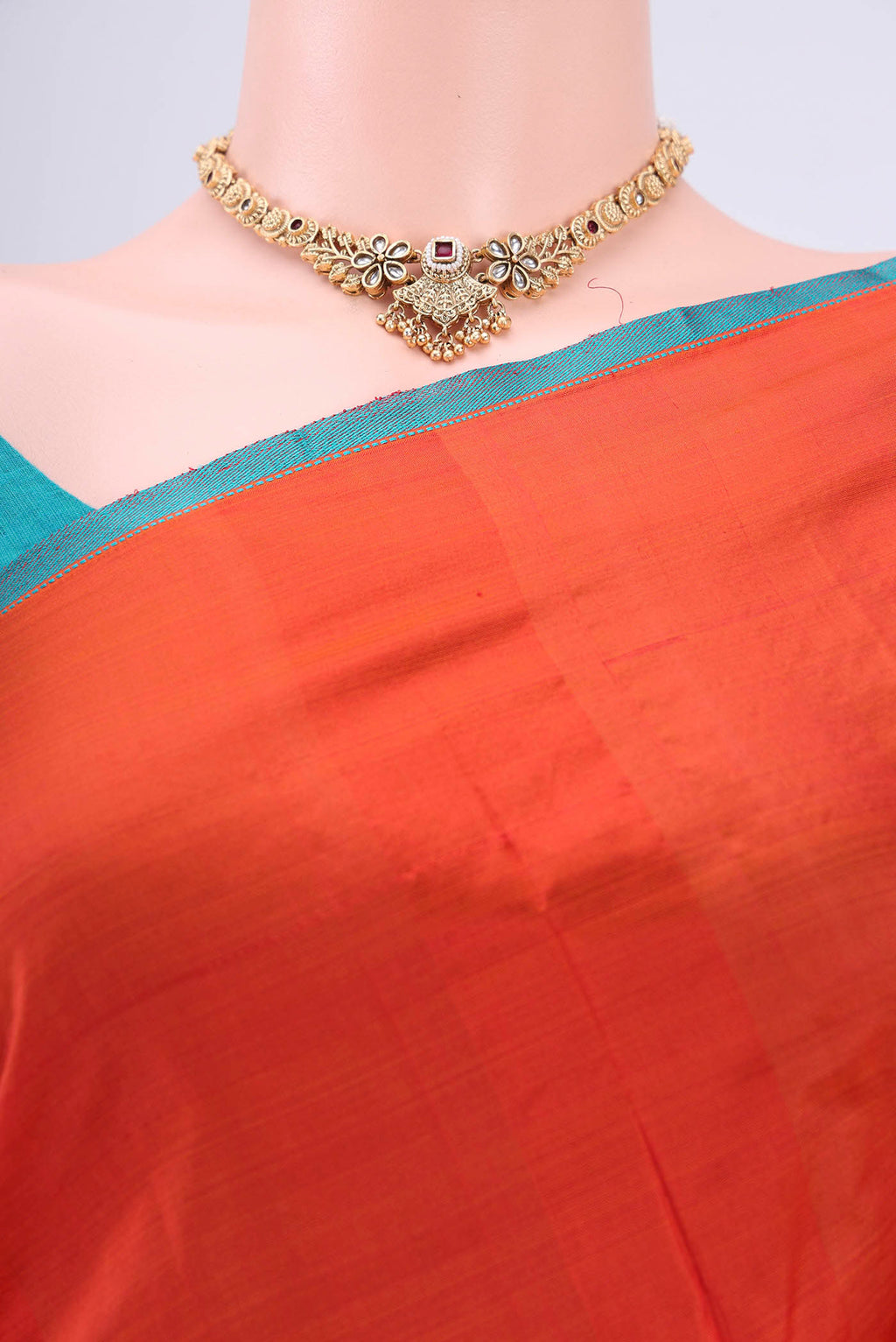 Border image of Brick Orange Kanchipuram Silk Saree with Plain Body and Thread Border. 
