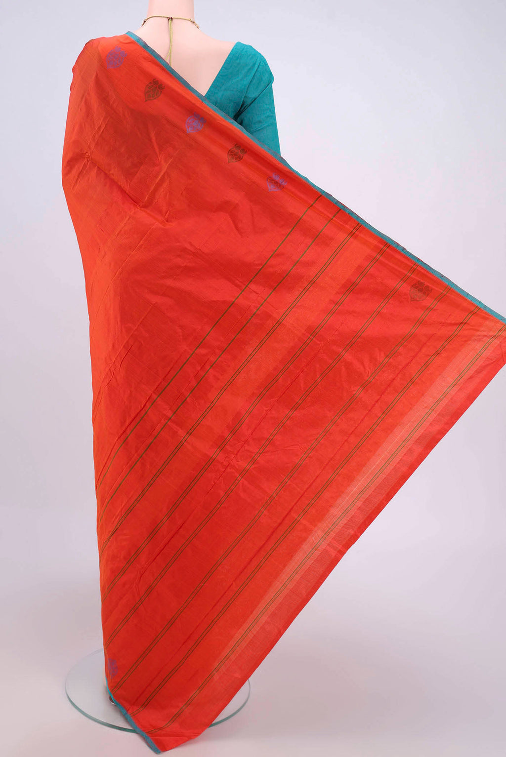 Flat view of Brick Orange Kanchipuram Silk Saree with Plain Body and Thread Border. 
