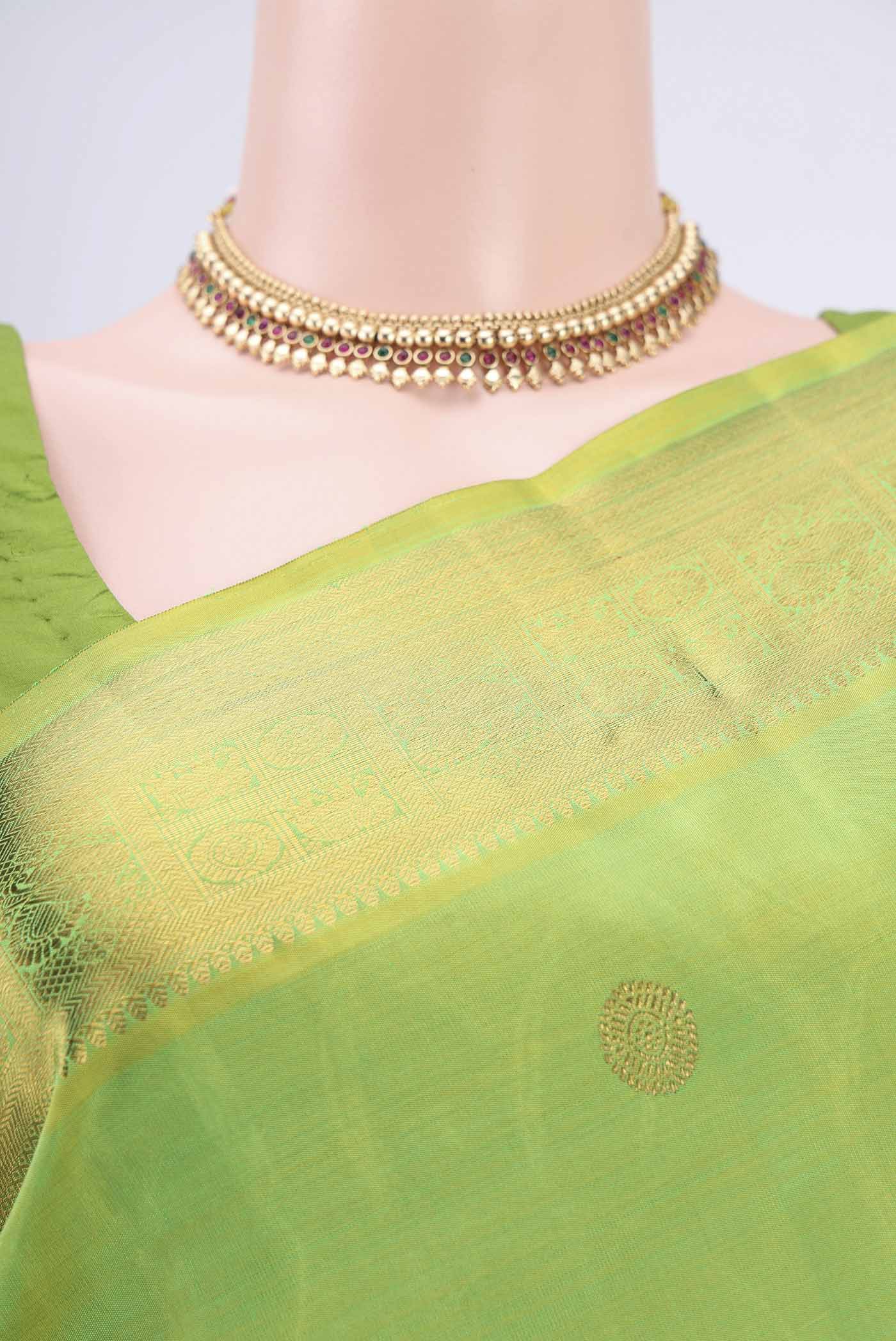 Border image of Pure Silk Pure Zari Parrot Green Dual Tone Kanchipuram Saree with Zari Butta on the body and Zari Border. 