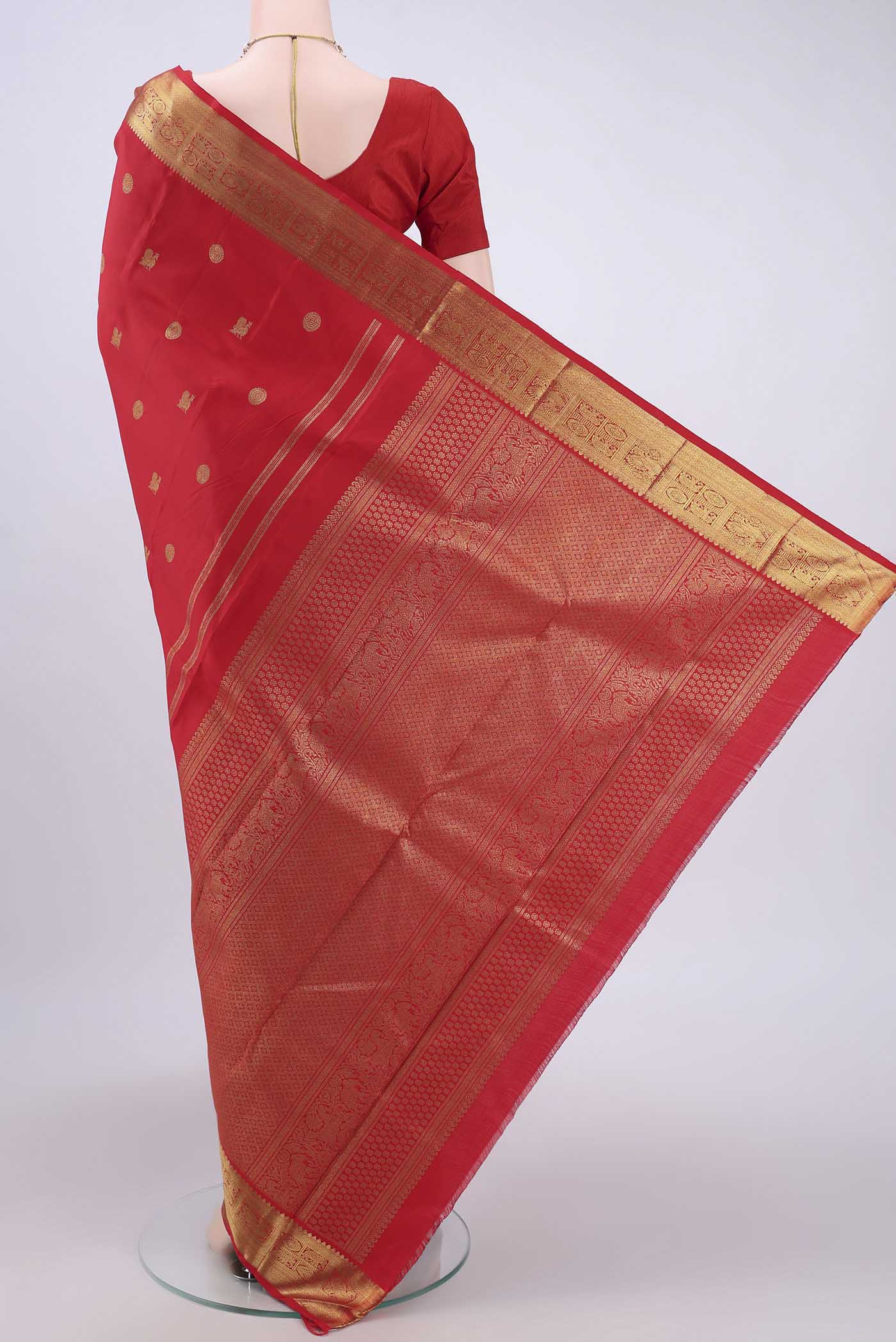 Flat view of Pure Silk Pure Zari Red Dual Tone Kanchipuram Saree with Zari Butta on the body and Zari Border. 
