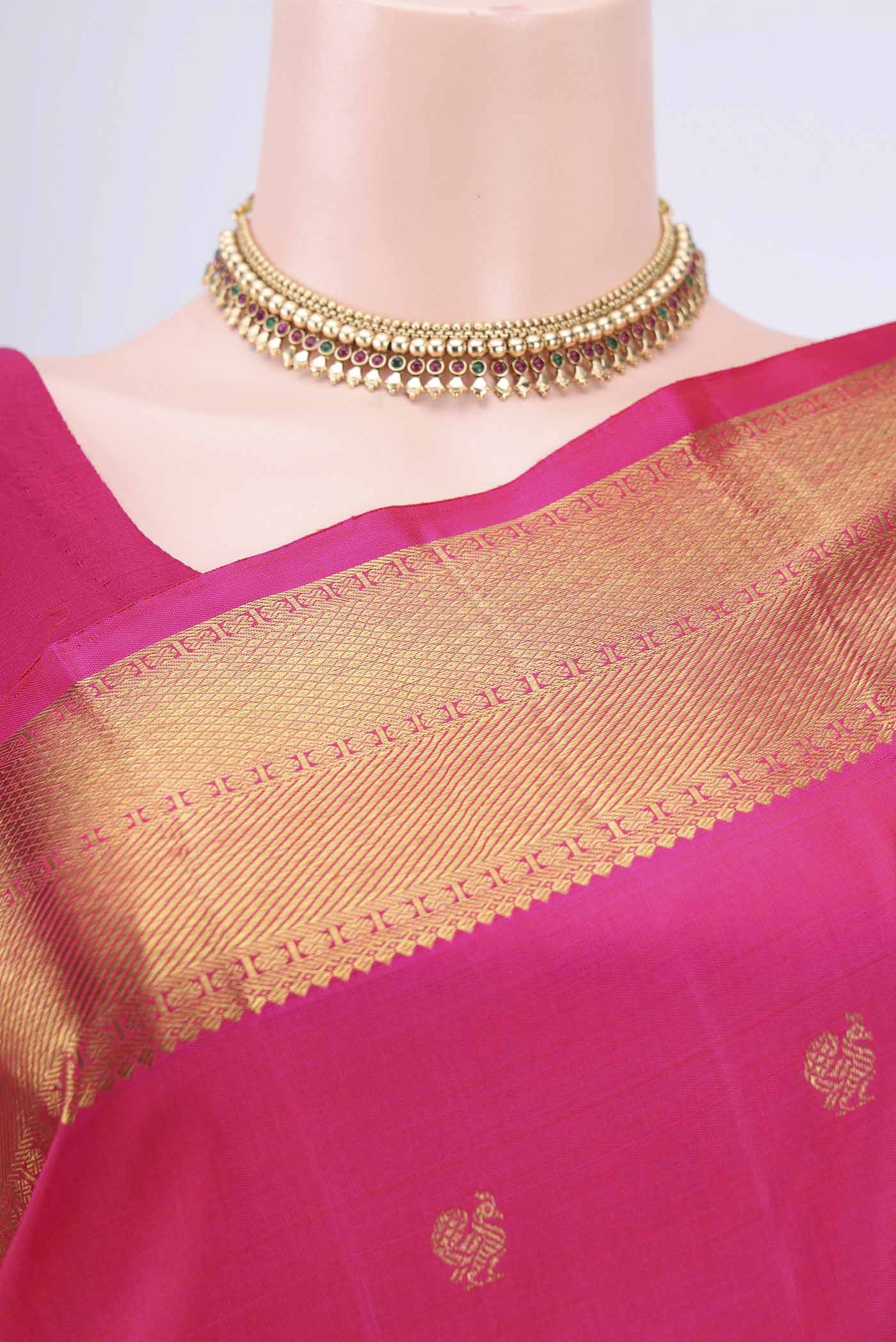 Border image of Pure Silk Pure Zari Rani Pink Dual Tone Kanjivaram Saree with Zari Butta on the body and Zari Border. 