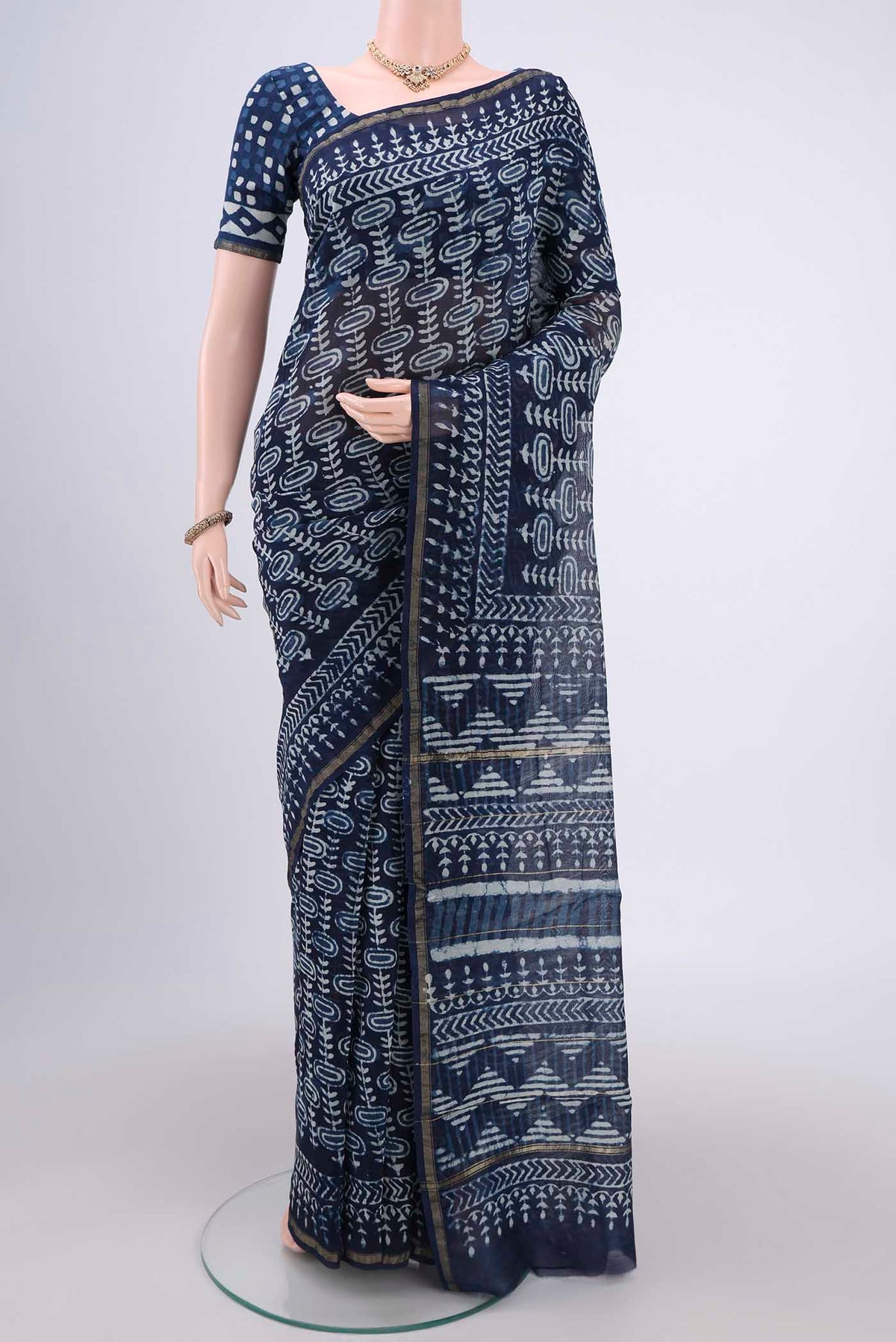 Indigo Chanderi Silk Saree with Batik Print on the body and Zari Border.  displayed on a mannequin