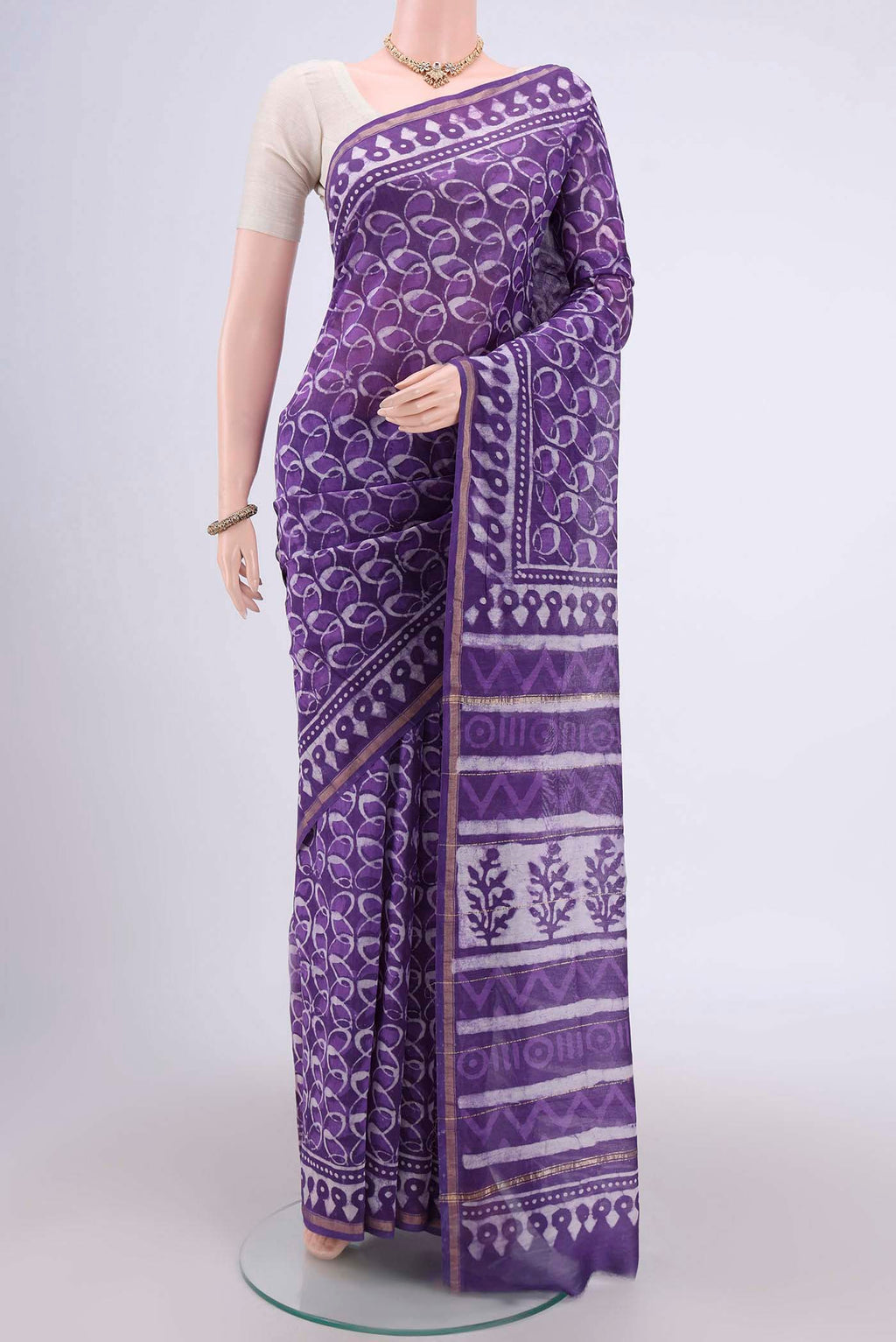 Purple Chanderi Silk Cotton Saree with Printed design on the body and Zari Border.  displayed on a mannequin