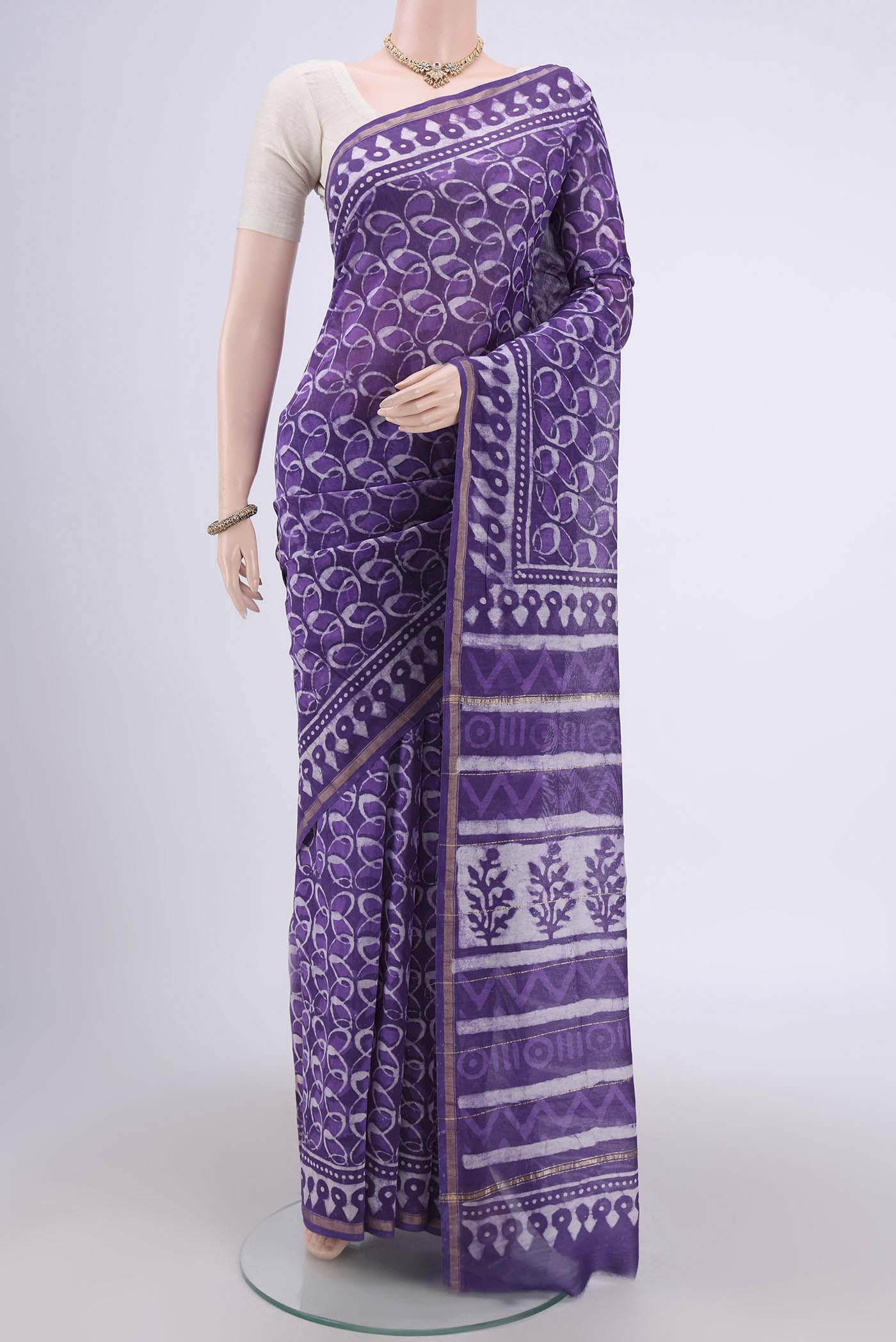 Purple Chanderi Silk Cotton Saree with Printed design on the body and Zari Border.  displayed on a mannequin
