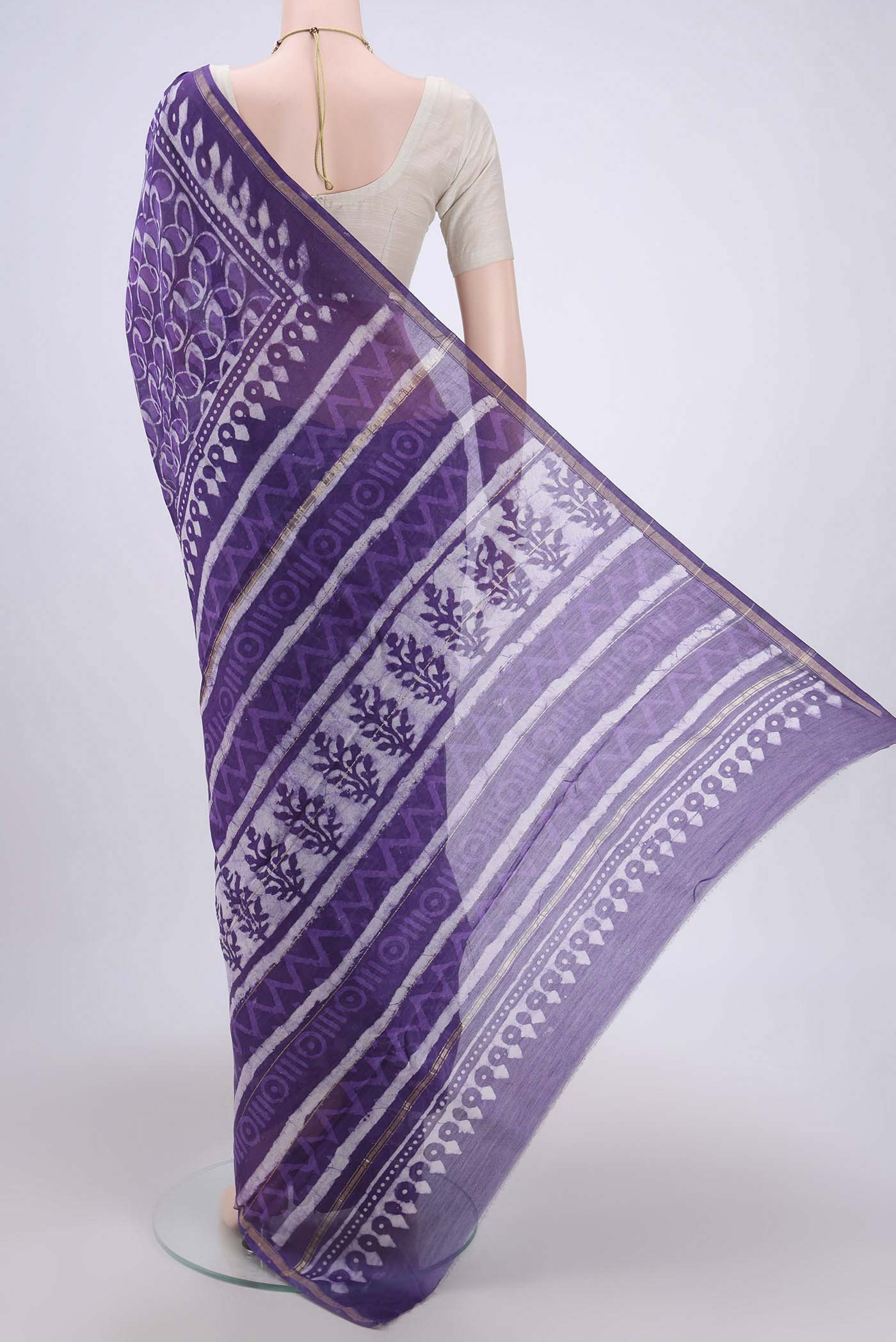 Flat view of Purple Chanderi Silk Cotton Saree with Printed design on the body and Zari Border. 