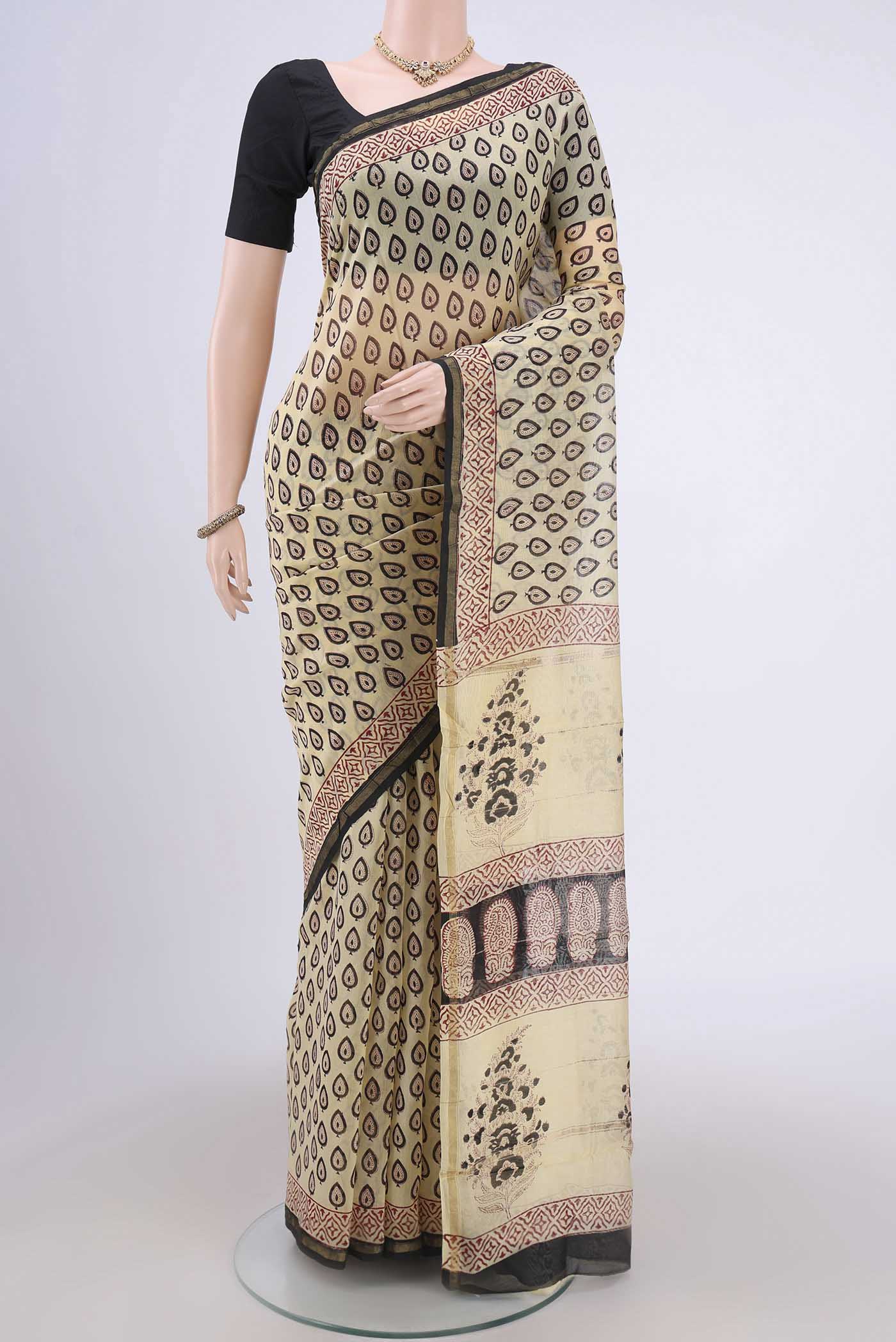Cream Chanderi Silk Cotton Saree with Printed design on the body and Zari Border.  displayed on a mannequin