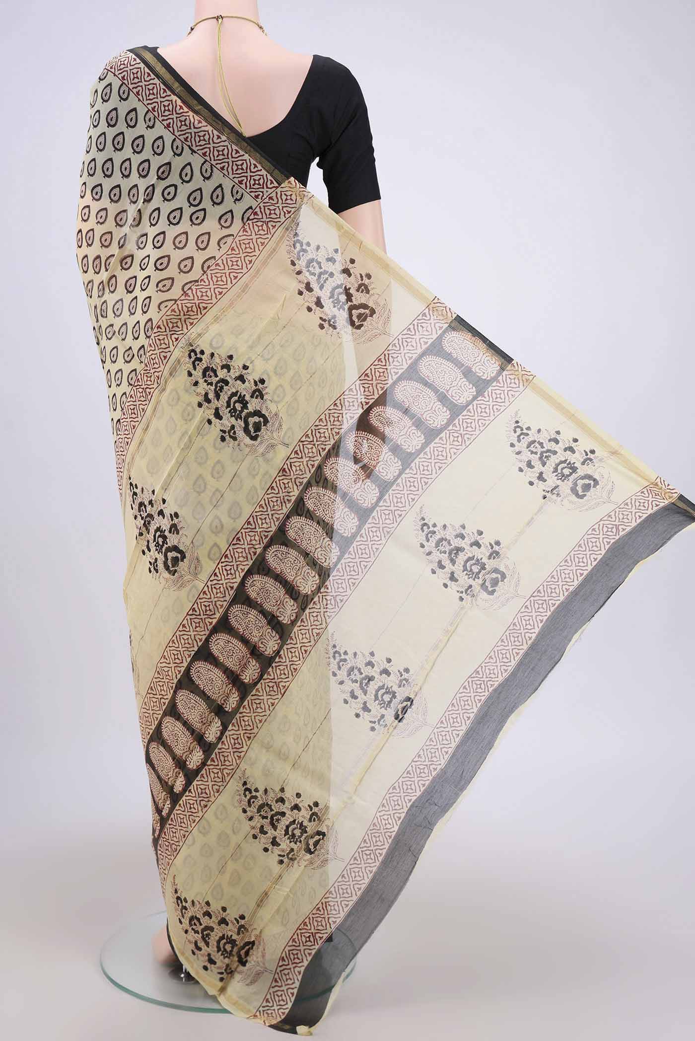 Flat view of Cream Chanderi Silk Cotton Saree with Printed design on the body and Zari Border. 