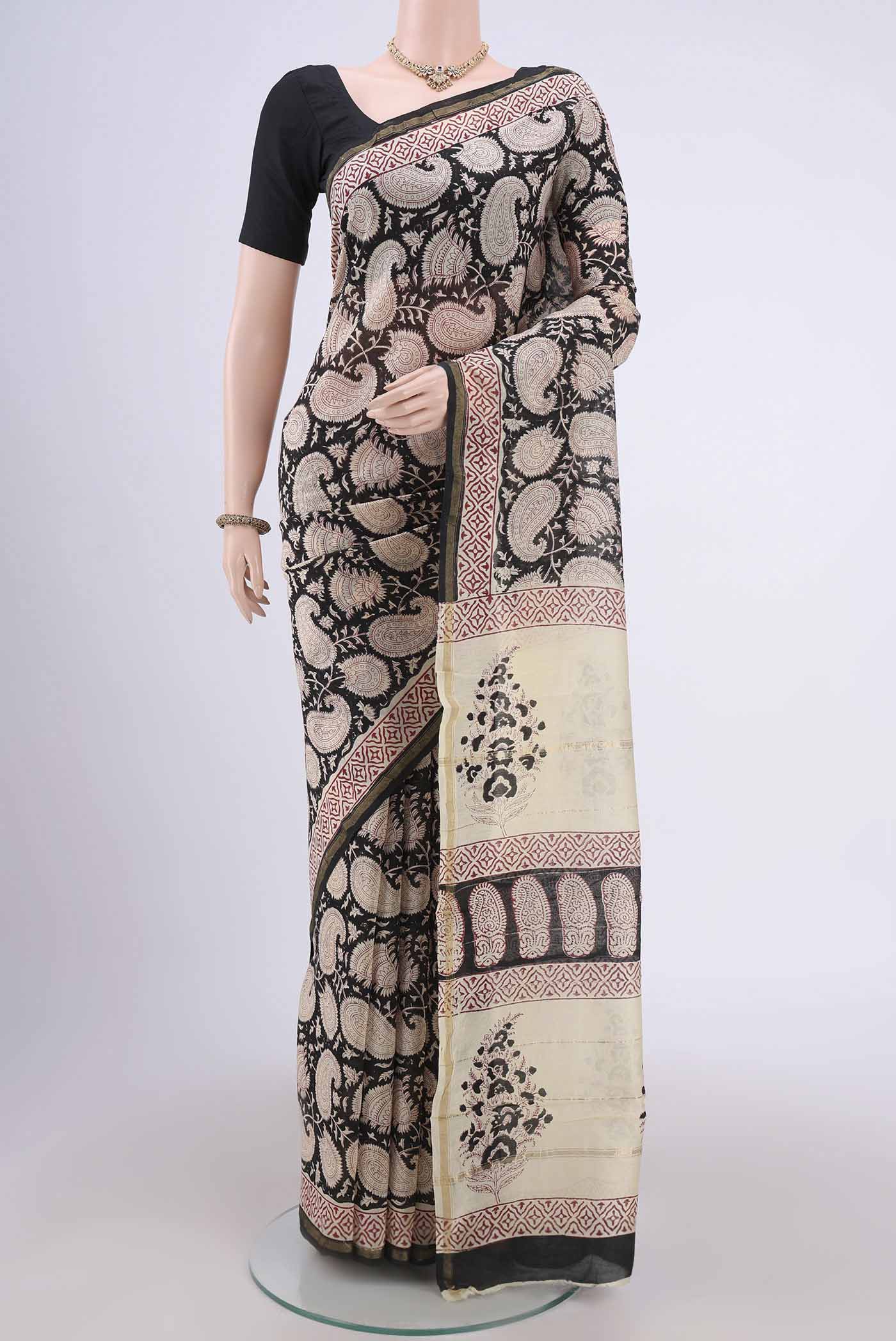 Black Chanderi Silk Cotton Saree with Printed design on the body and Zari Border.  displayed on a mannequin