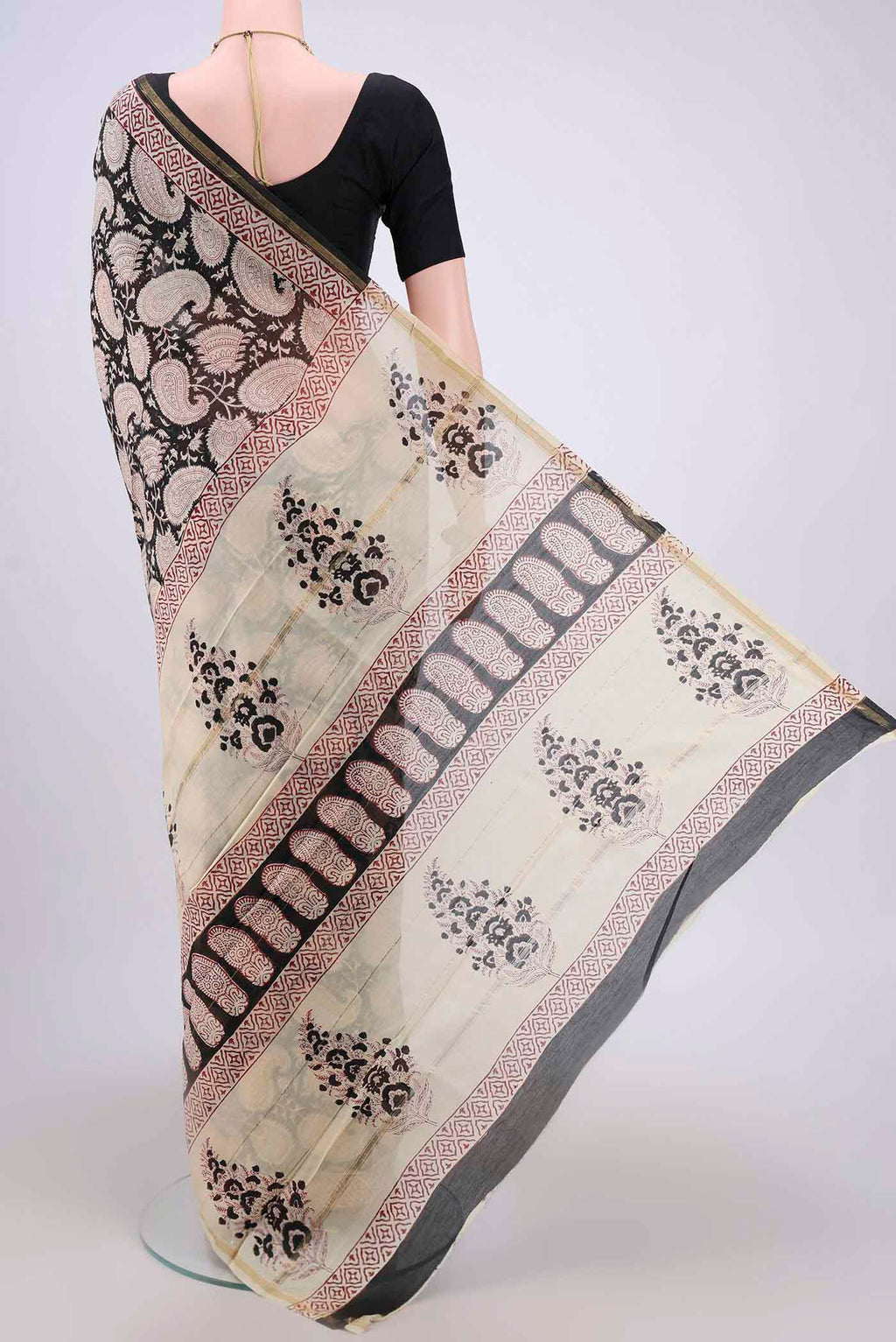 Flat view of Black Chanderi Silk Cotton Saree with Printed design on the body and Zari Border. 