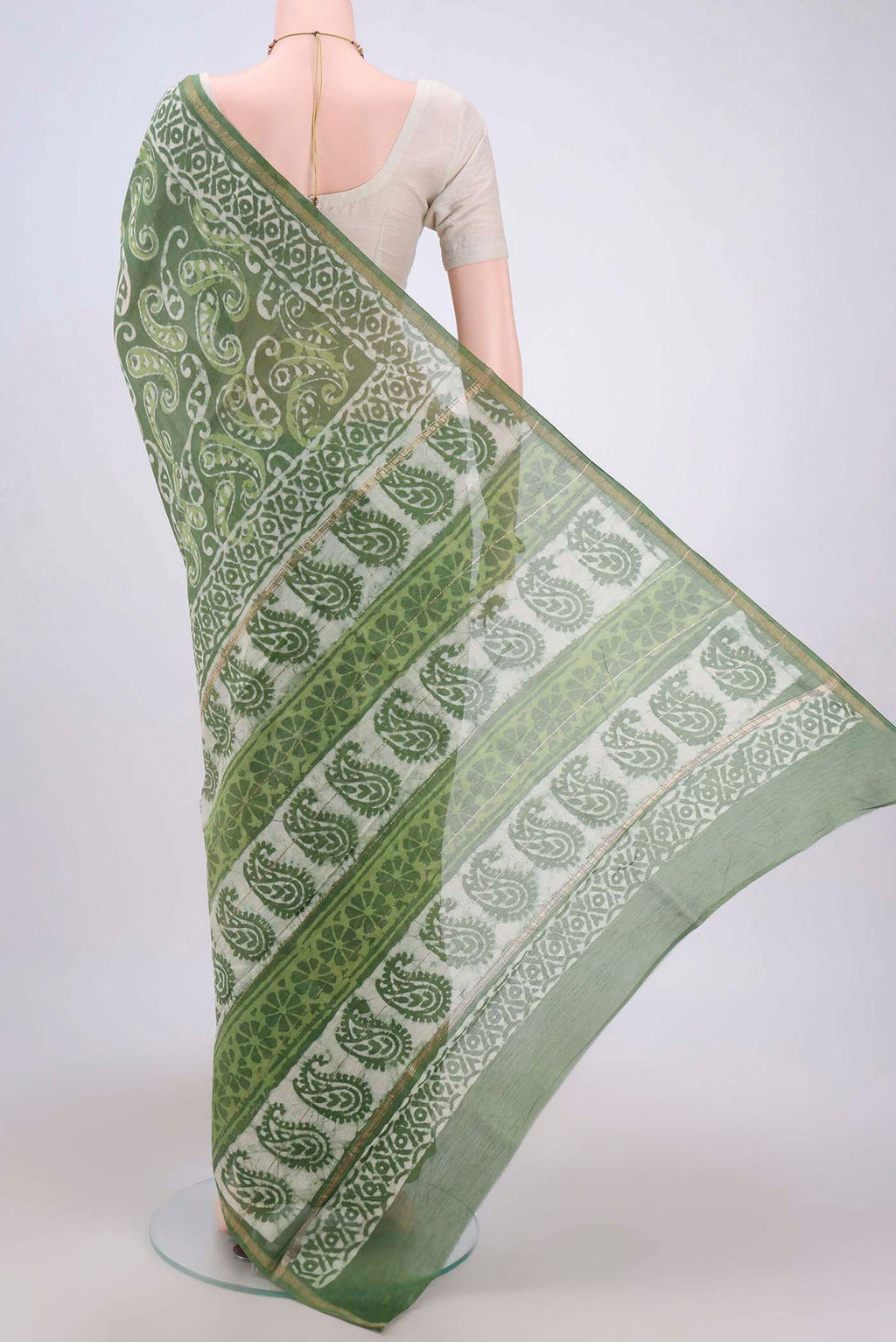 Flat view of Light Green Maheshwari Silk Cotton Saree with Batik Print on the body and Zari Border. 