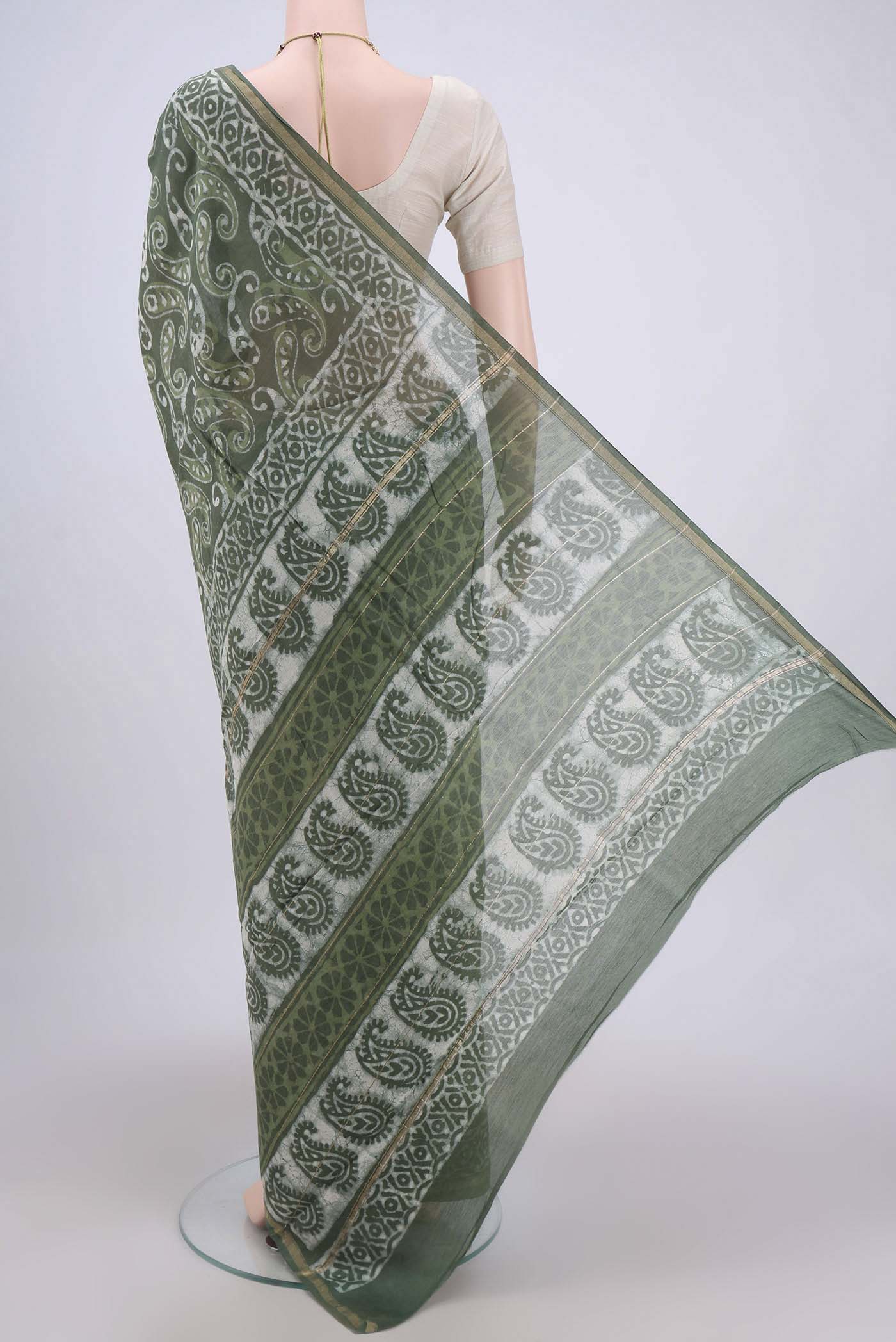 Flat view of Sage Green Chanderi Silk Cotton Saree with Printed design on the body and Zari Border. 