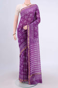 Purple Maheshwari Silk Cotton Saree with Printed design on the body and Zari Border.  displayed on a mannequin