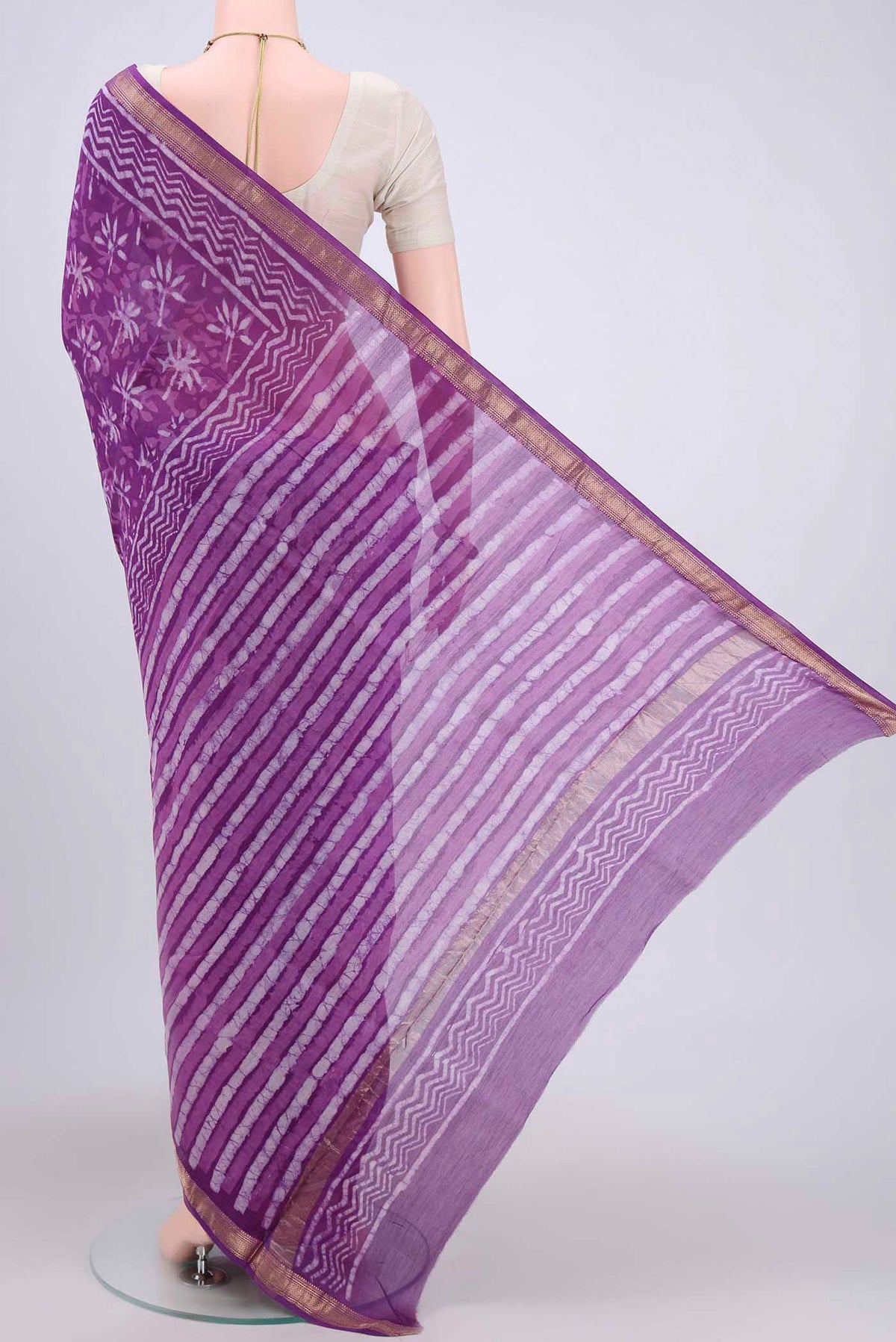 Flat view of Purple Maheshwari Silk Cotton Saree with Printed design on the body and Zari Border. 