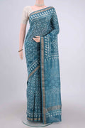 Blue Maheshwari Silk Cotton Saree with Batik Print on the body and Zari Border.  displayed on a mannequin