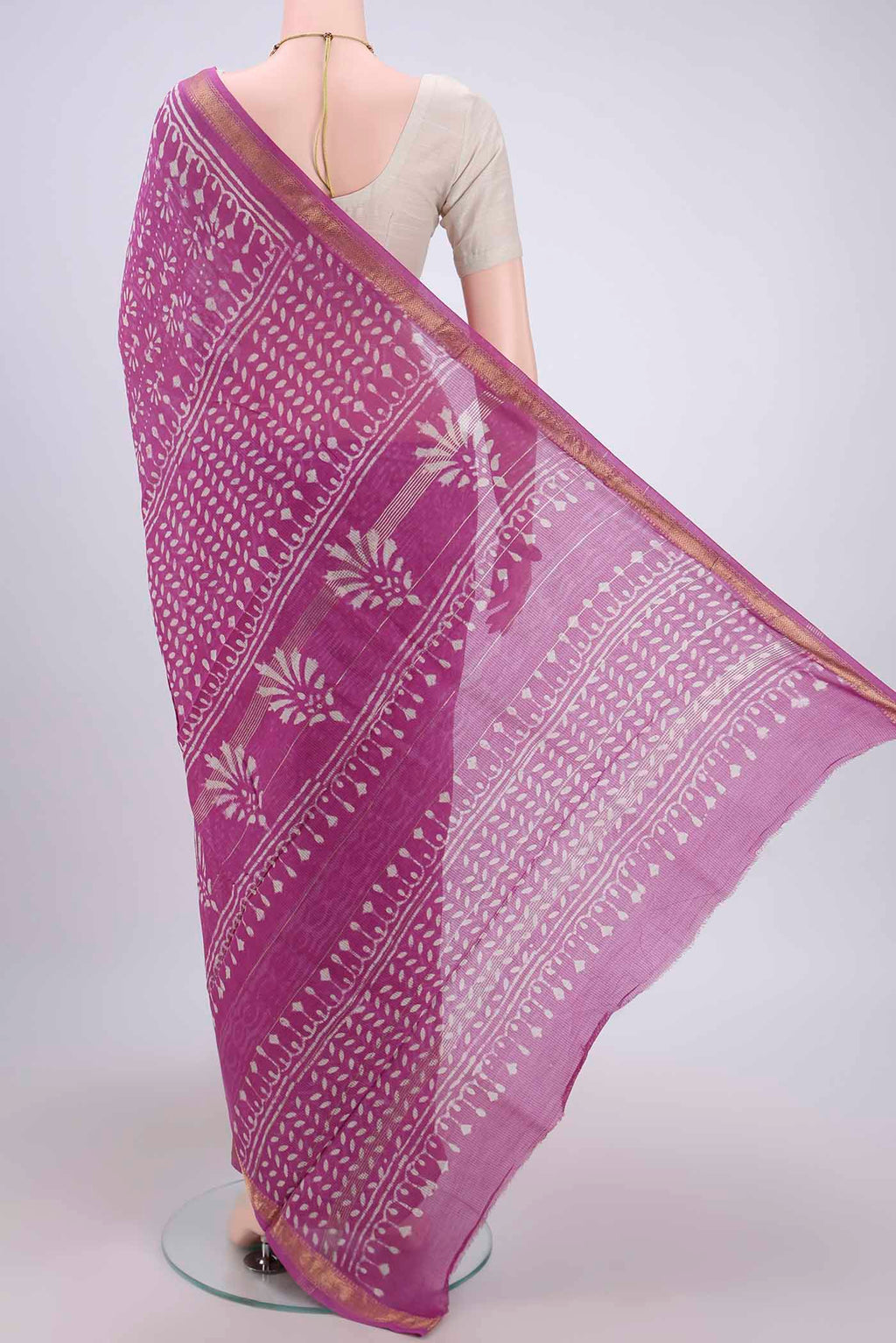 Flat view of Pink Maheshwari Silk Cotton Saree with Batik Print on the body and Zari Border. 
