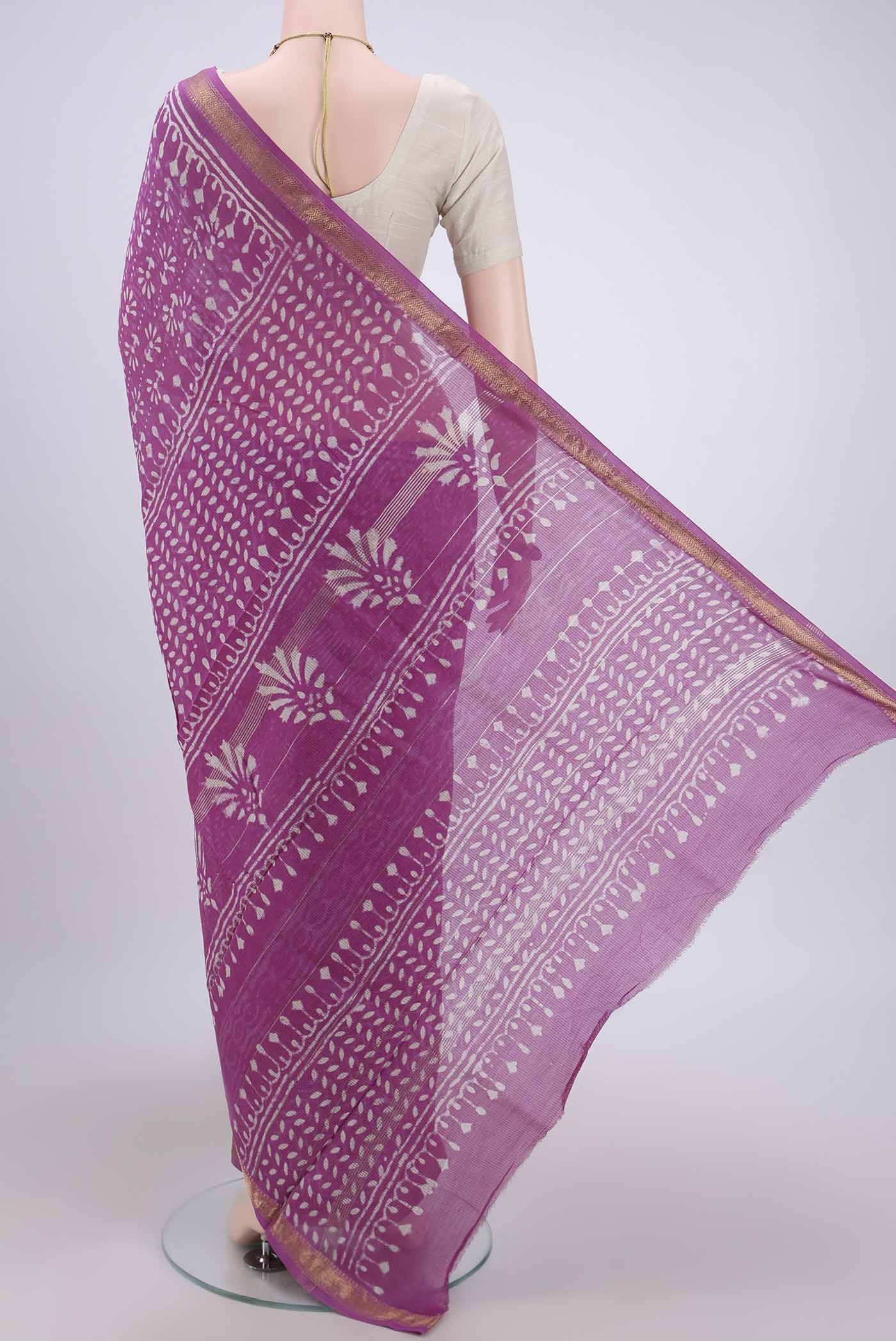 Flat view of Pink Maheshwari Silk Cotton Saree with Batik Print on the body and Zari Border. 