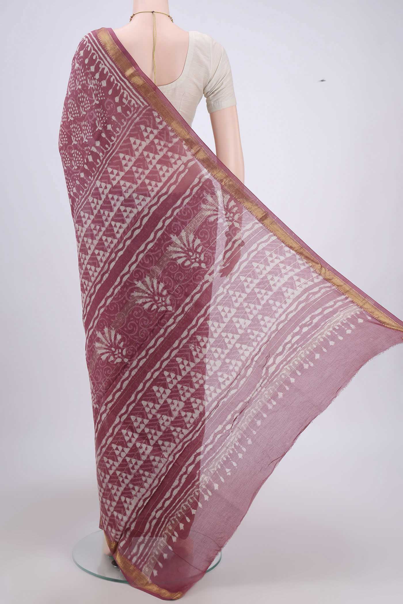 Flat view of Pink Maheshwari Silk Cotton Saree with Batik Print on the body and Zari Border. 