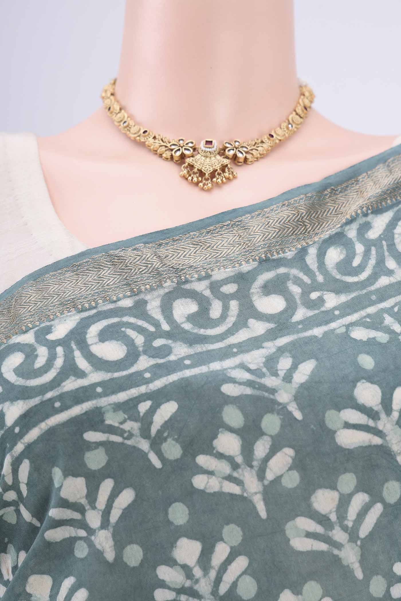 Border image of Blue Grey Maheshwari Silk Cotton Saree with Batik Print on the body and Zari Border. 