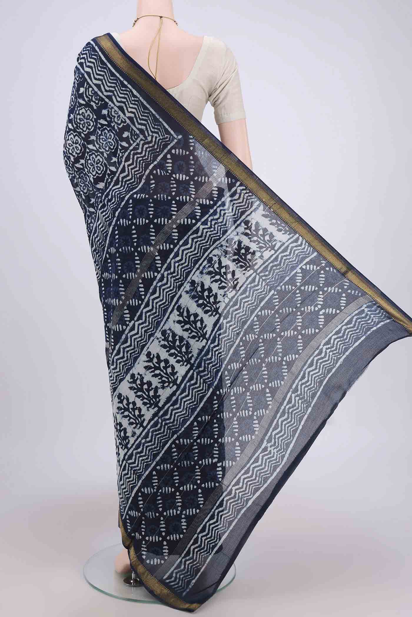 Flat view of Indigo Maheshwari Silk Cotton Saree with Batik Print on the body and Zari Border. 