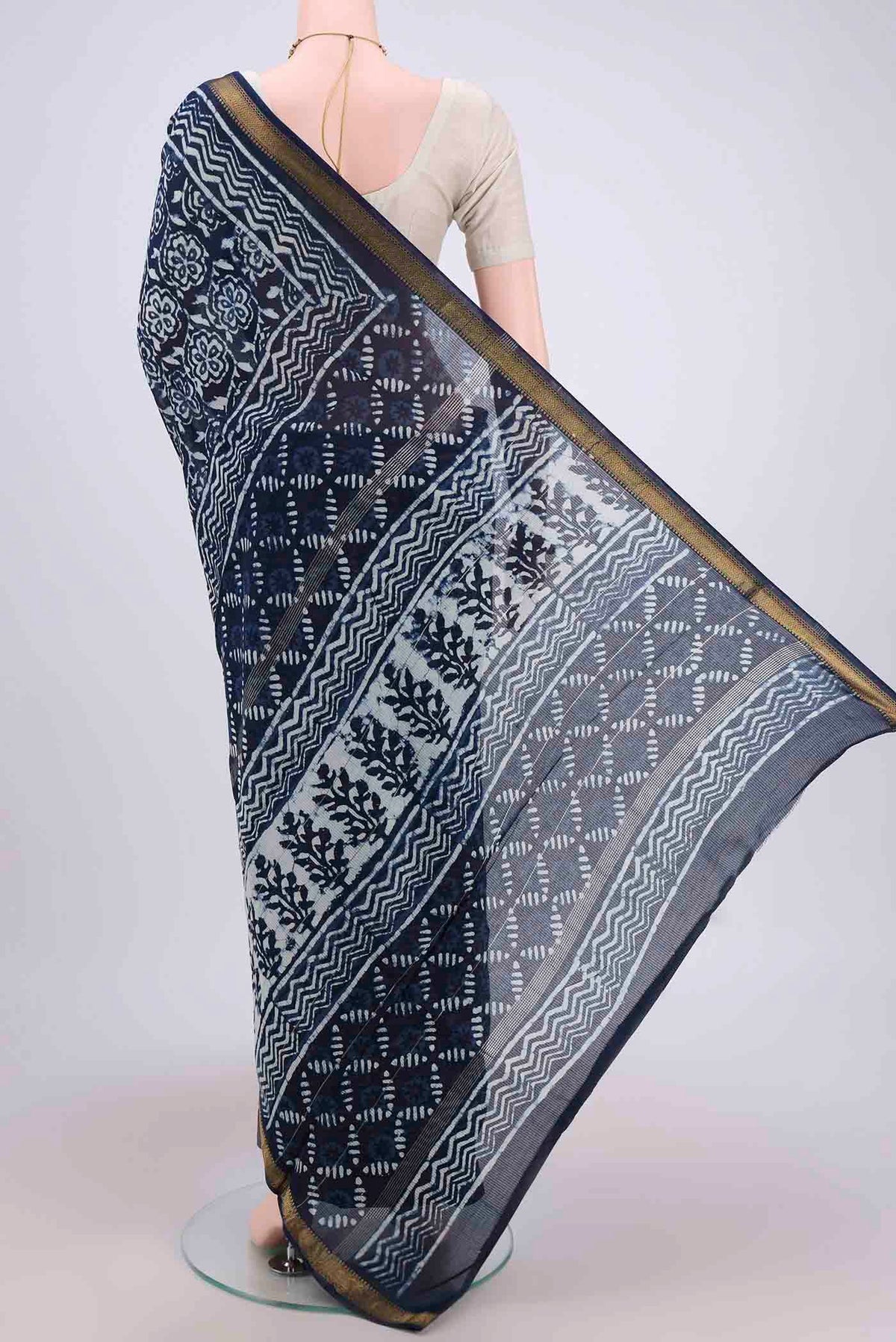 Flat view of Indigo Maheshwari Silk Cotton Saree with Batik Print on the body and Zari Border. 