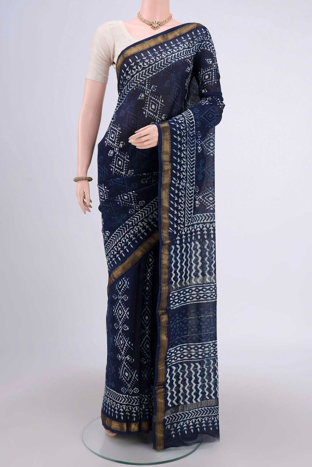 Indigo Maheshwari Silk Cotton Saree with Printed design on the body and Zari Border.  displayed on a mannequin