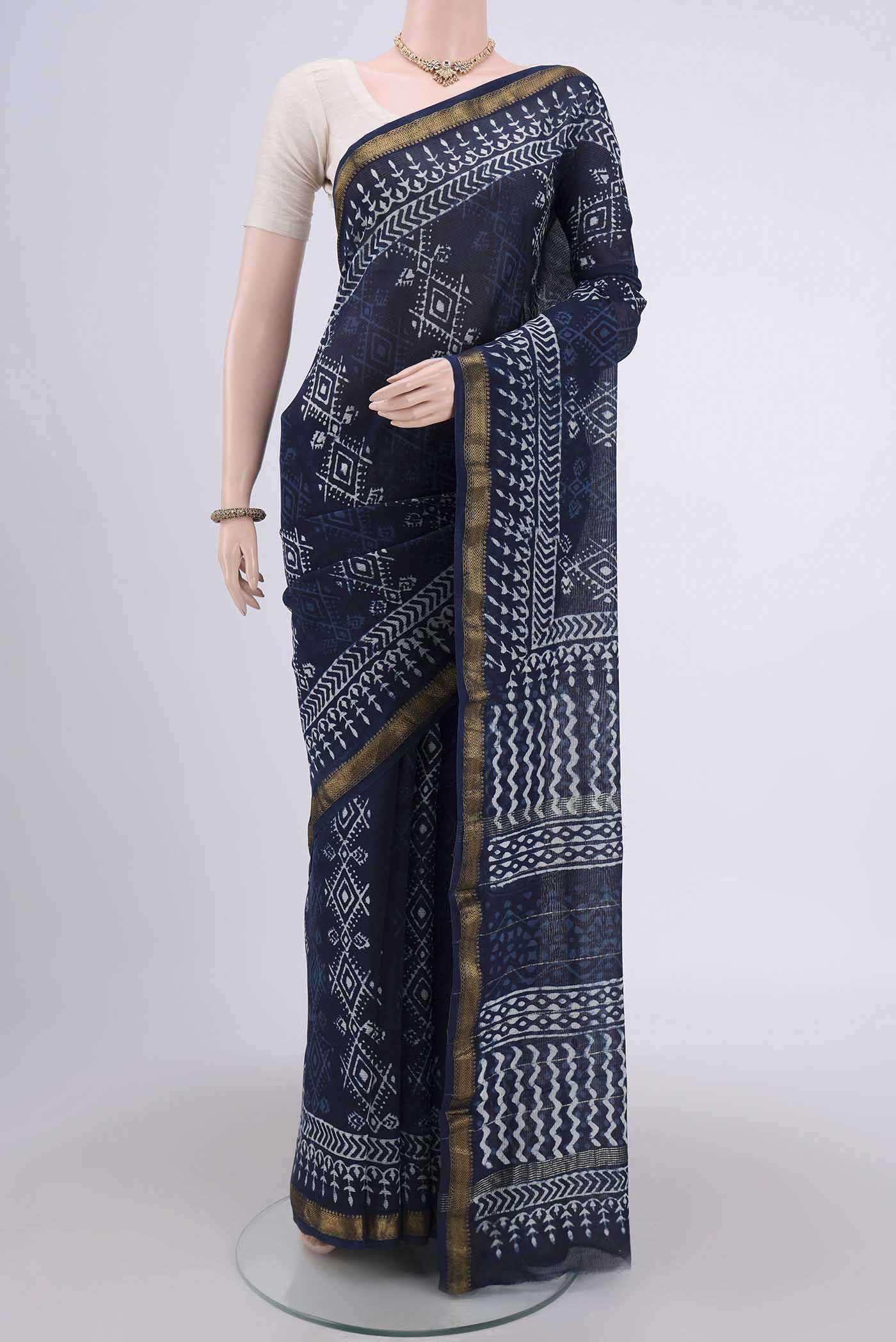 Indigo Maheshwari Silk Cotton Saree with Printed design on the body and Zari Border.  displayed on a mannequin